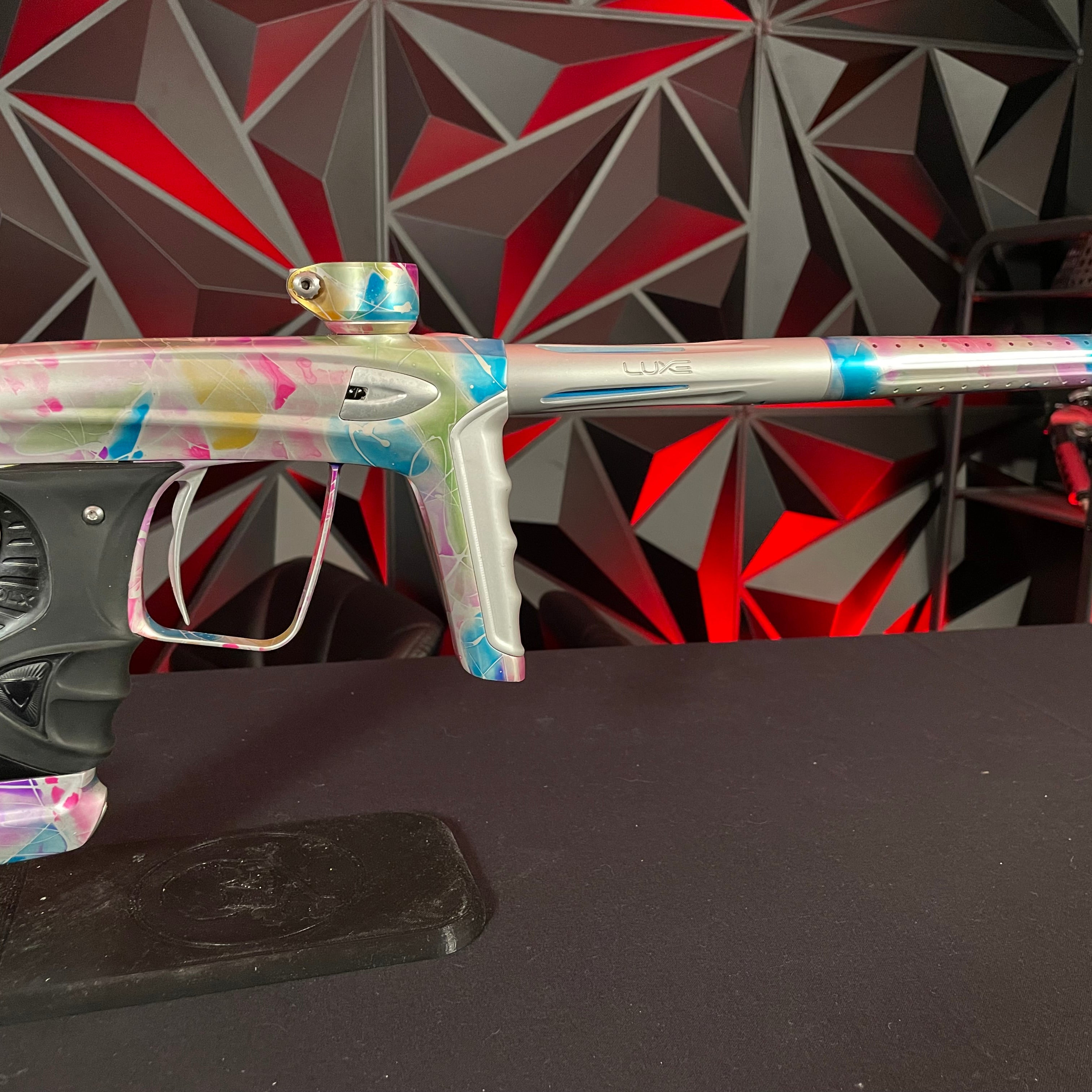 Used DLX Luxe ICE Paintball Gun - Multi-Color Splash w/ 4 Freak Inserts