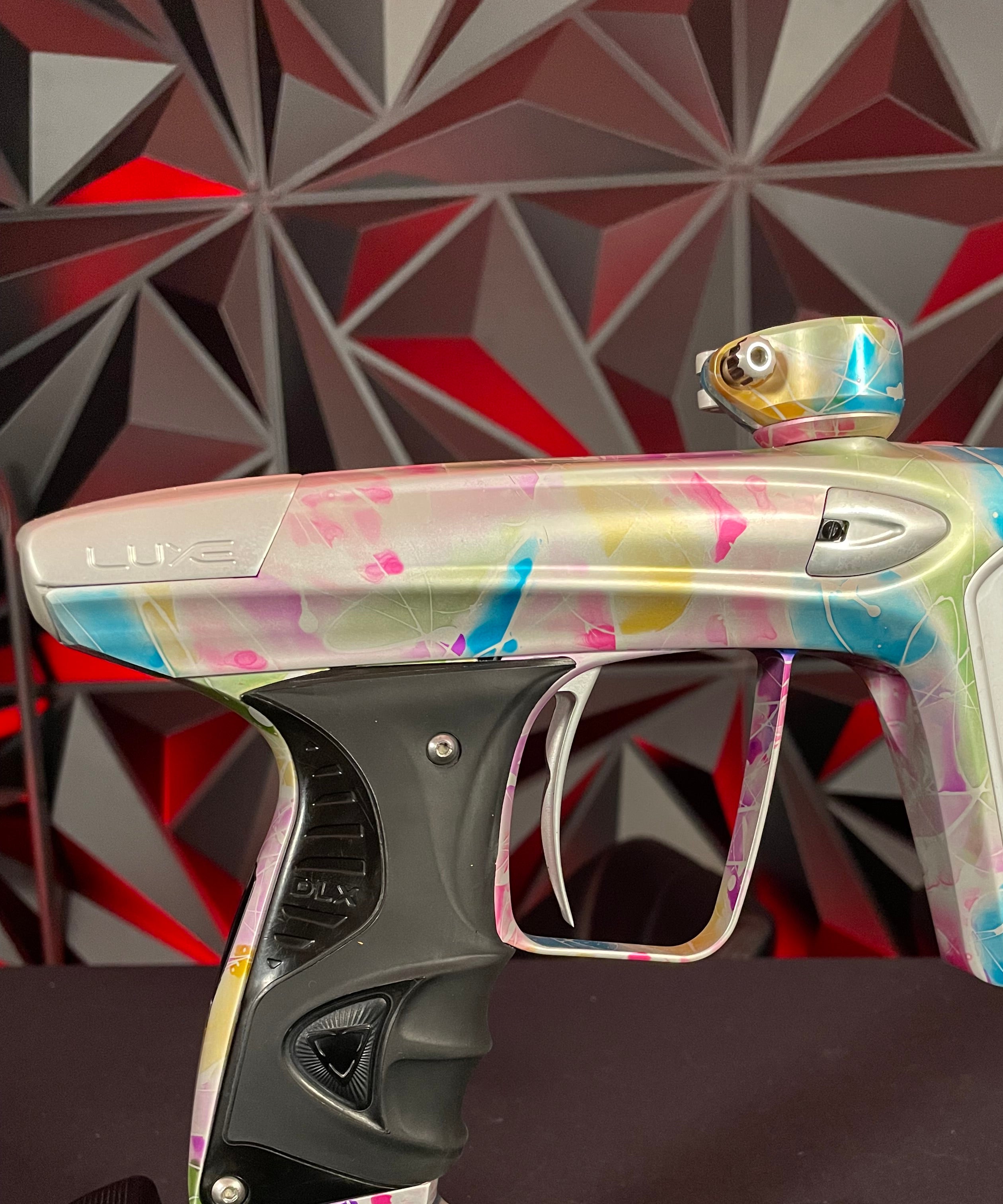 Used DLX Luxe ICE Paintball Gun - Multi-Color Splash w/ 4 Freak Inserts