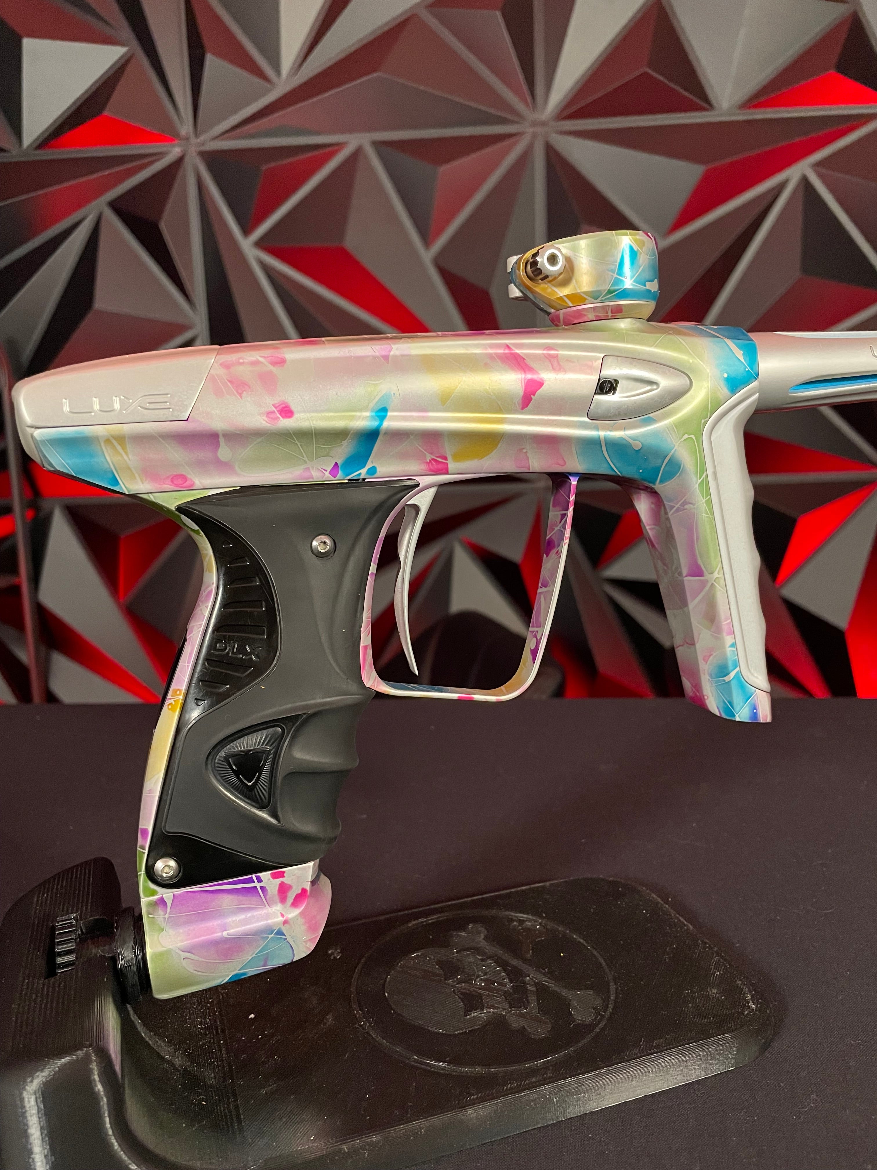 Used DLX Luxe ICE Paintball Gun - Multi-Color Splash w/ 4 Freak Inserts