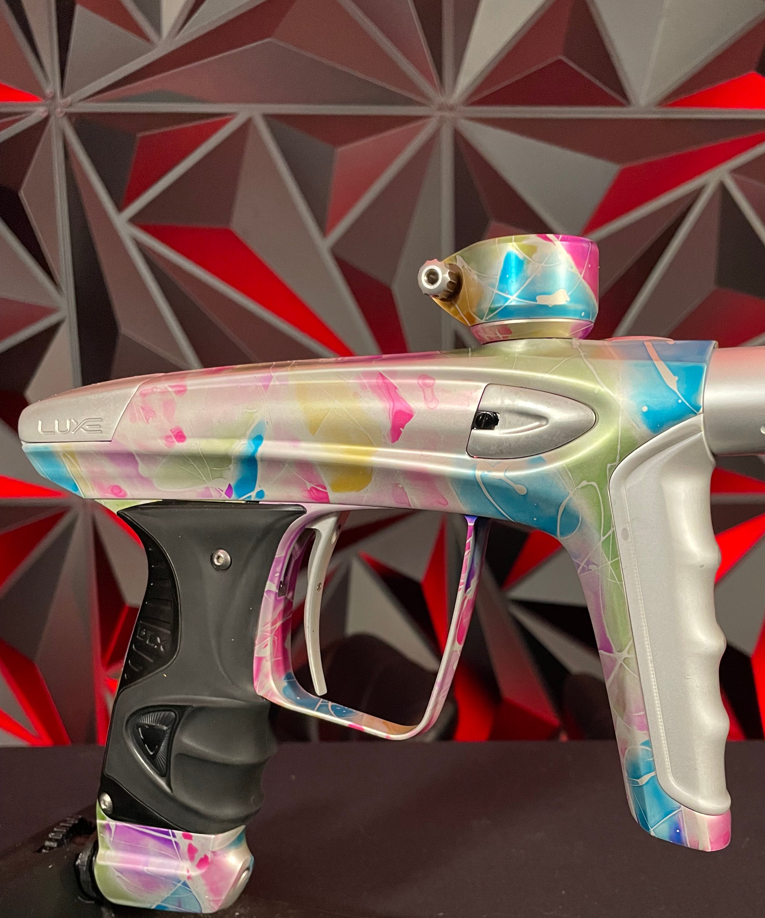 Used DLX Luxe ICE Paintball Gun - Multi-Color Splash w/ 4 Freak Inserts