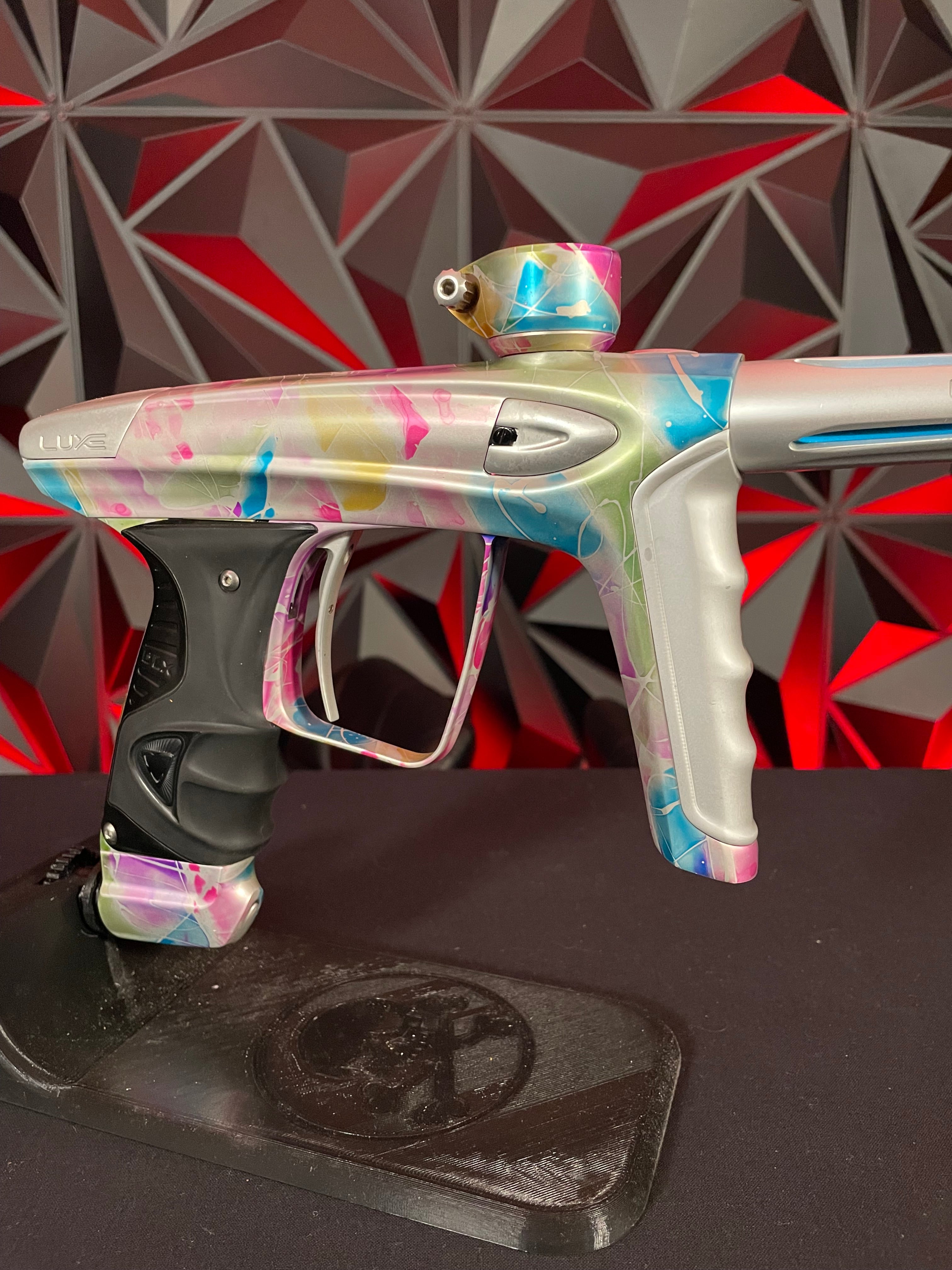 Used DLX Luxe ICE Paintball Gun - Multi-Color Splash w/ 4 Freak Inserts