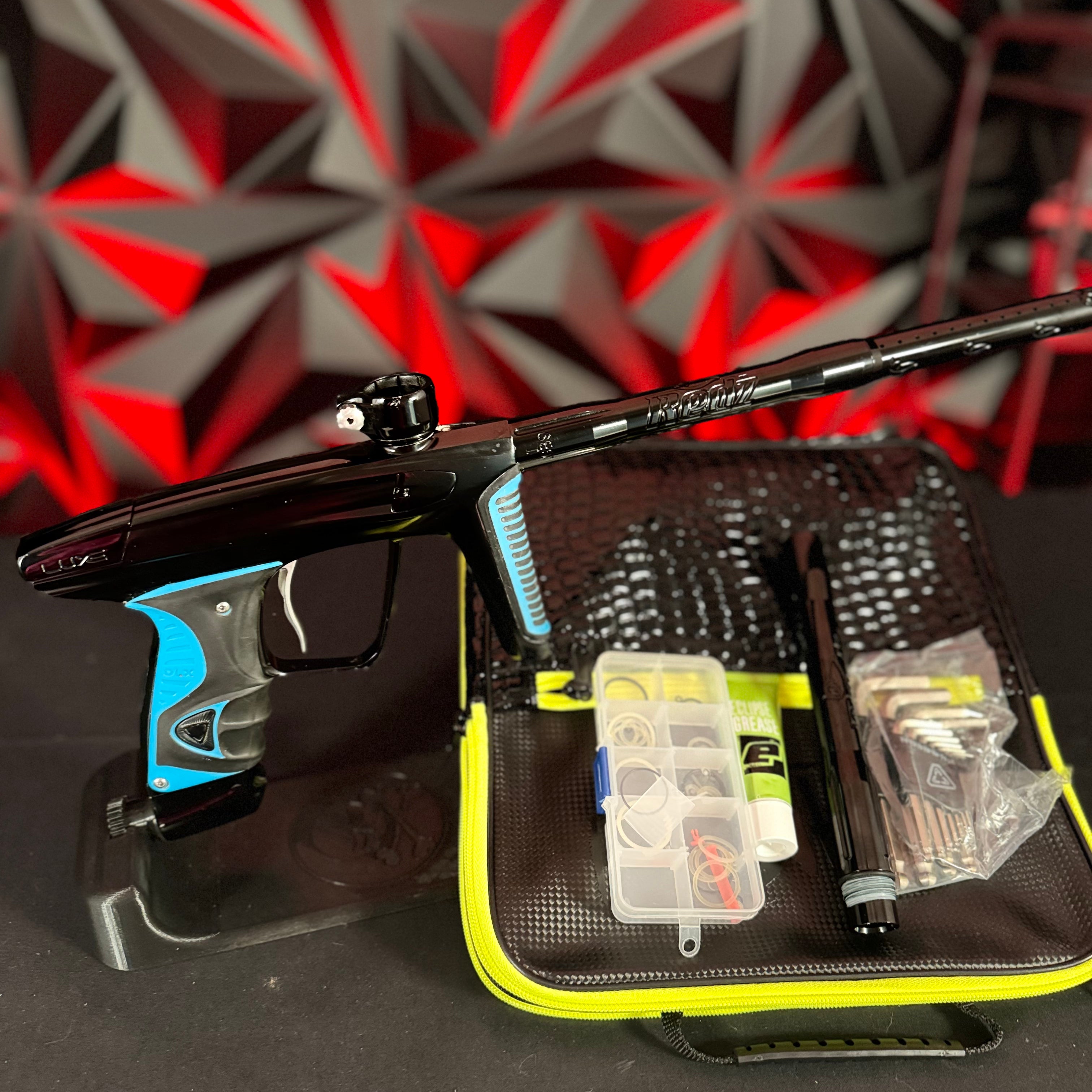 Used DLX Luxe X Paintball Gun - Black w/ Blue Grips