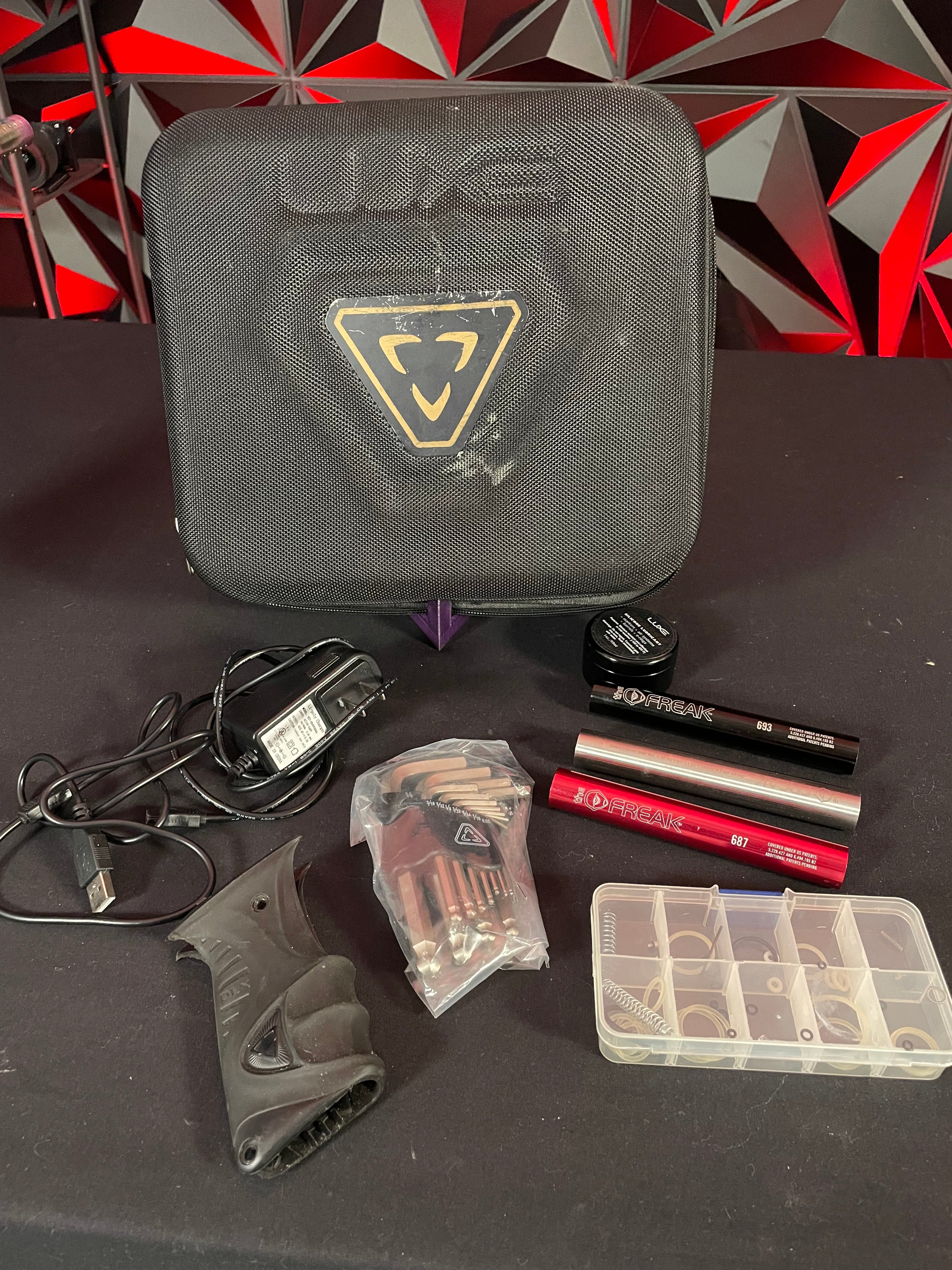 Used DLX Luxe ICE Paintball Gun - Multi-Color Splash w/ 4 Freak Inserts