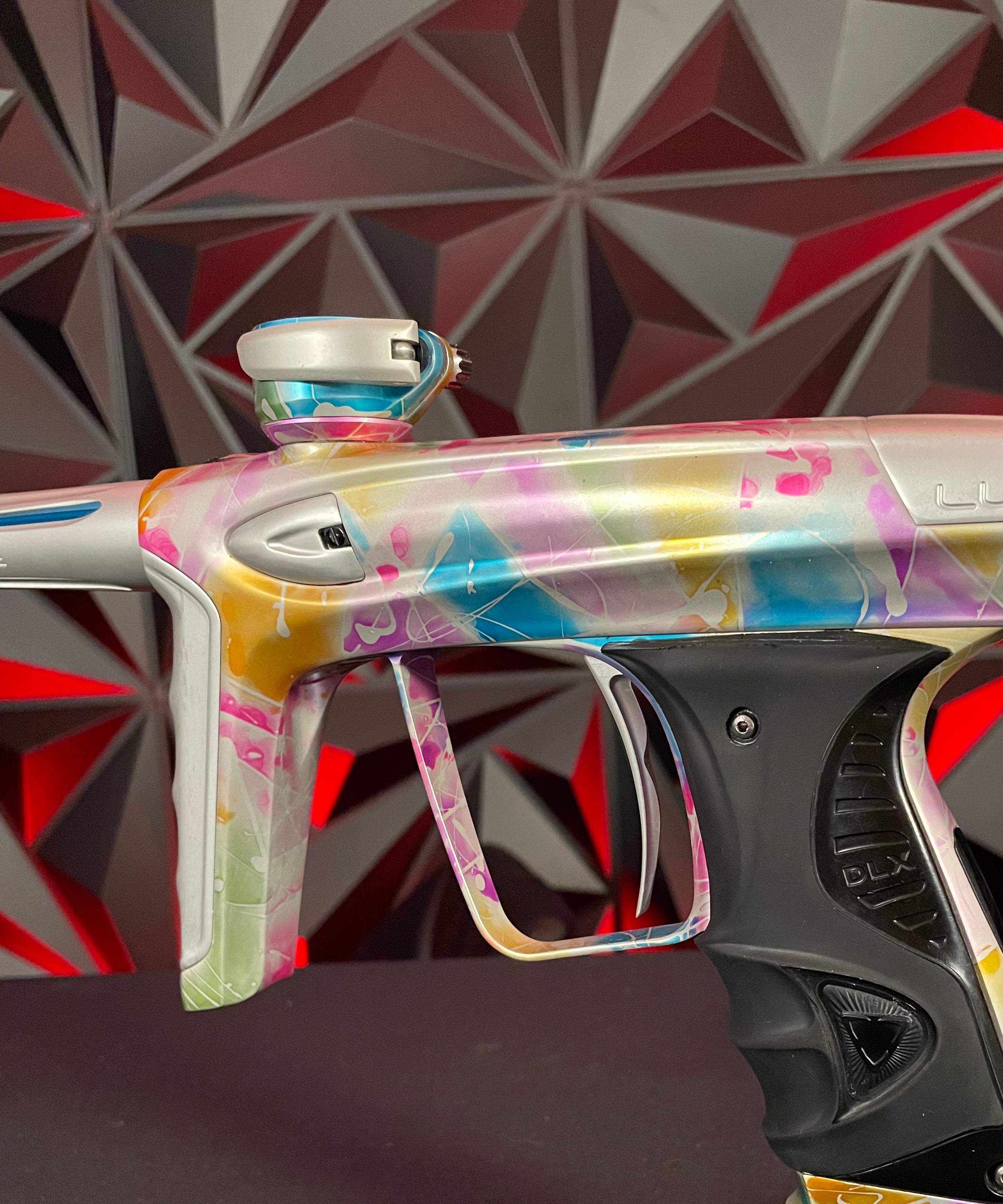 Used DLX Luxe ICE Paintball Gun - Multi-Color Splash w/ 4 Freak Inserts