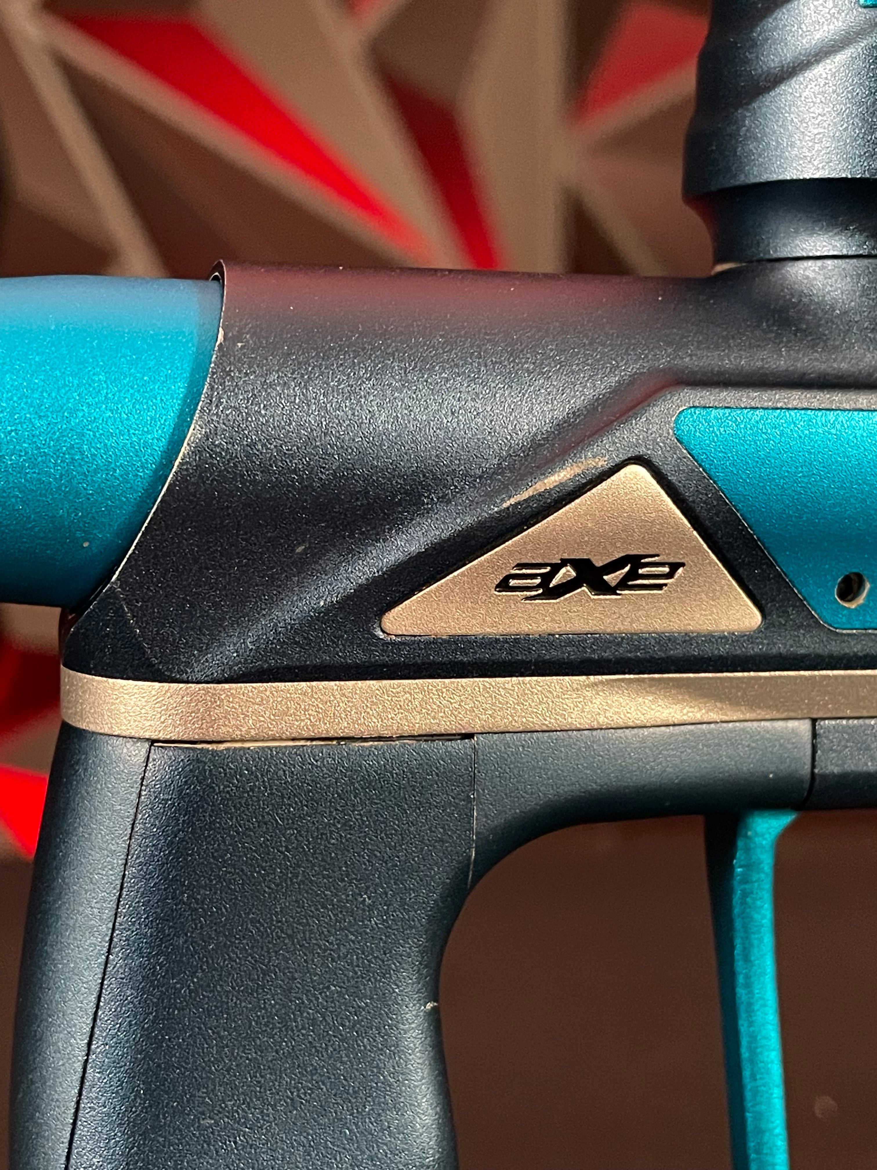 Used Empire Axe Pro Paintball Gun - Blue/Silver w/ Redline Board