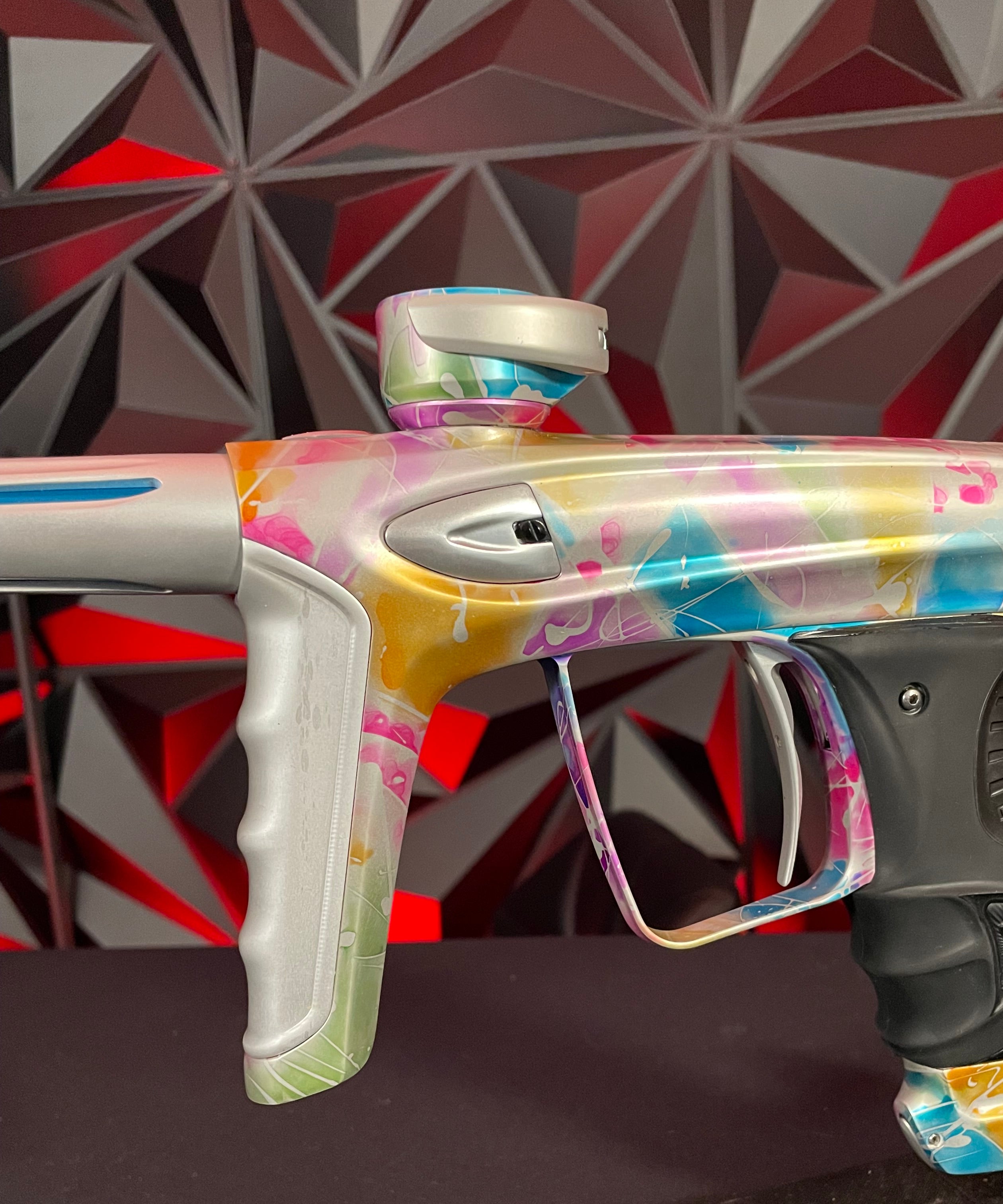Used DLX Luxe ICE Paintball Gun - Multi-Color Splash w/ 4 Freak Inserts