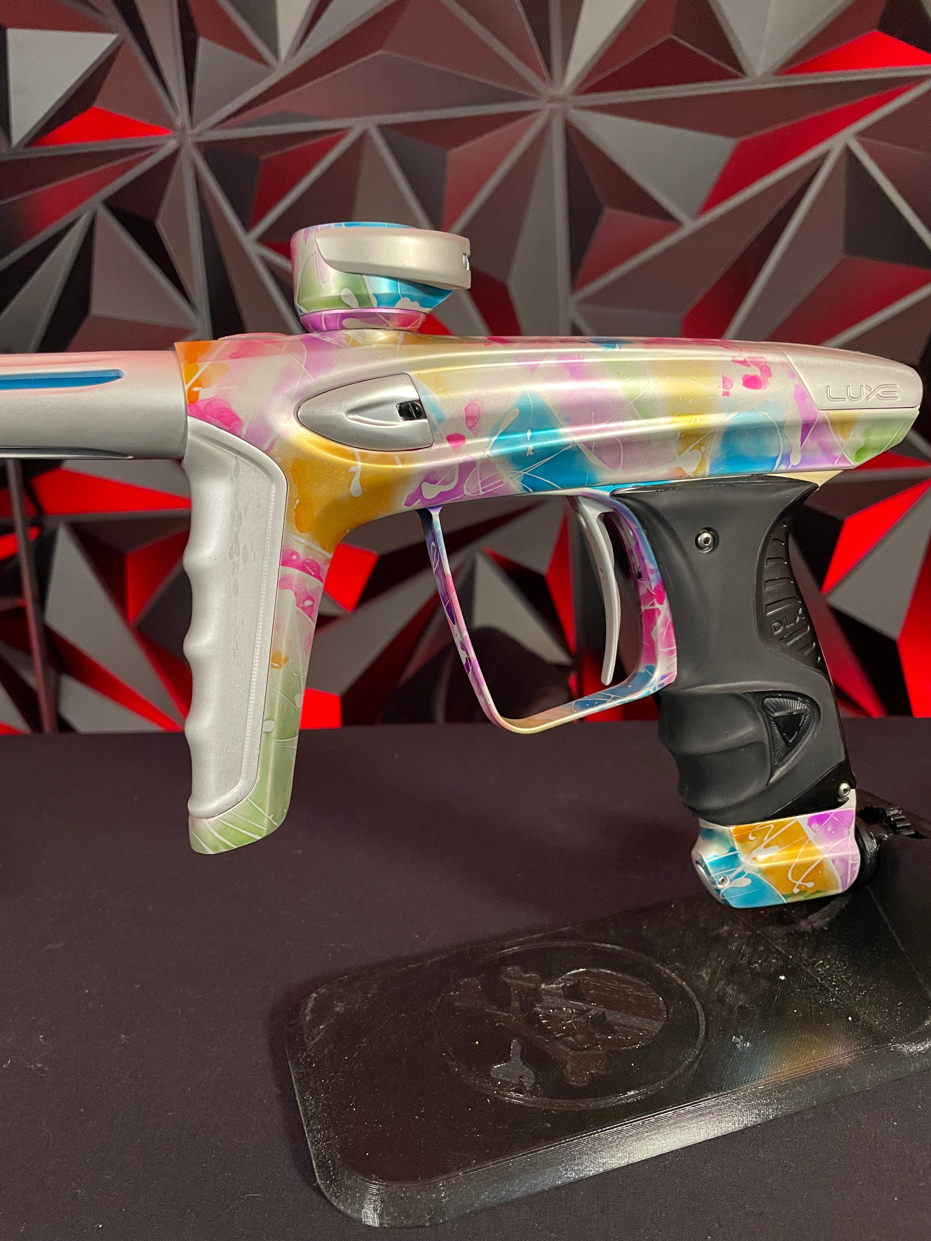 Used DLX Luxe ICE Paintball Gun - Multi-Color Splash w/ 4 Freak Inserts