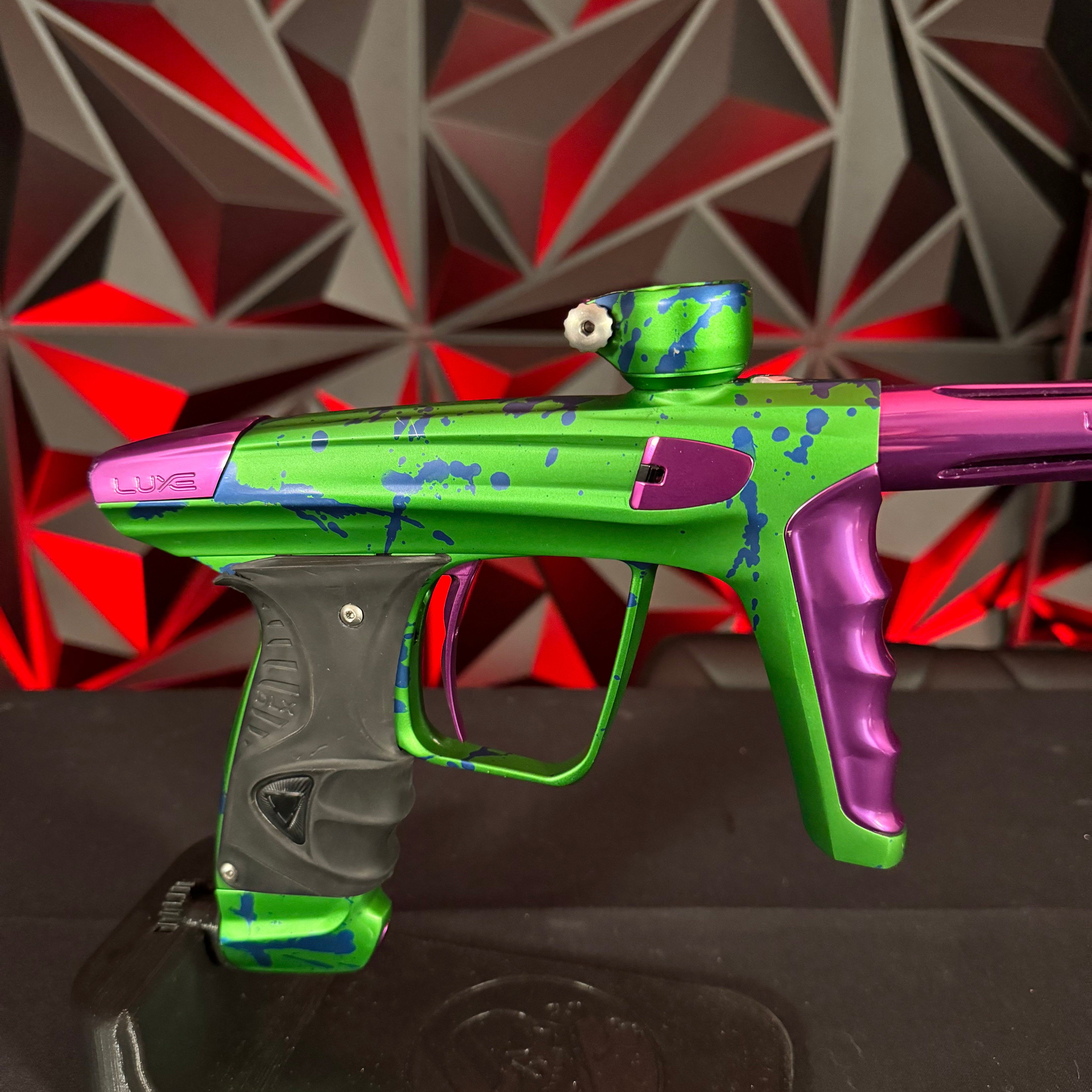 Used DLX Luxe X Paintball Marker - LE Green/Purple Splash w/Green ACP Tip