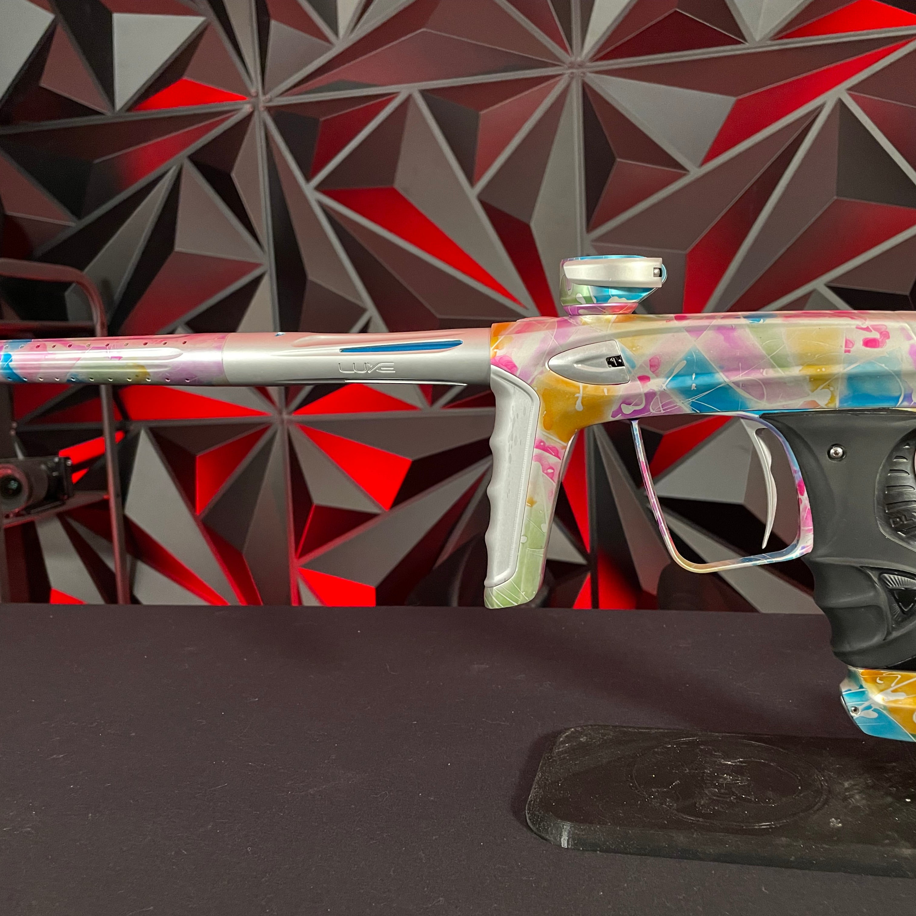 Used DLX Luxe ICE Paintball Gun - Multi-Color Splash w/ 4 Freak Inserts