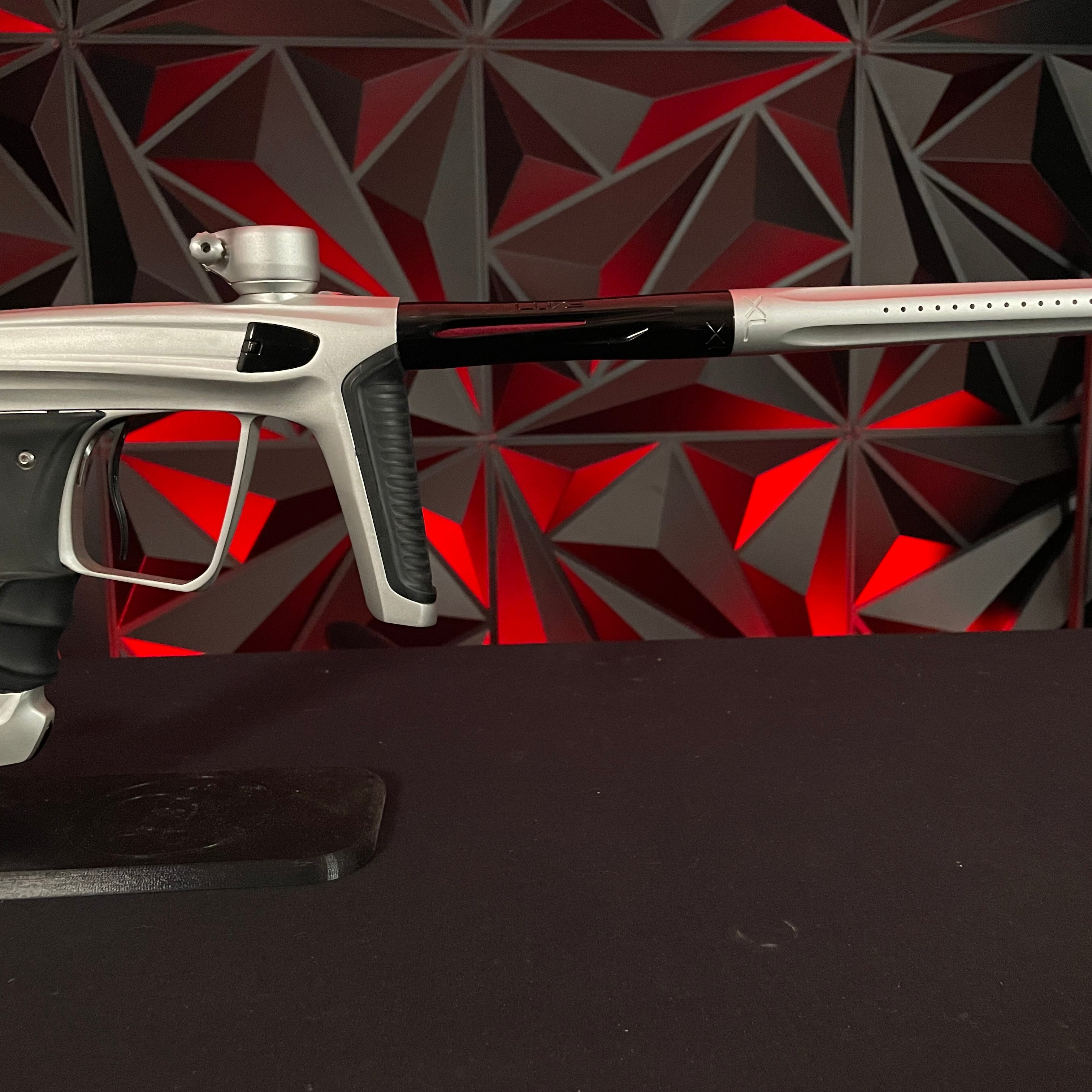Used DLX Luxe X Paintball Gun - Dust Silver/Polished Black w/Scythe Trigger & Spare Grips