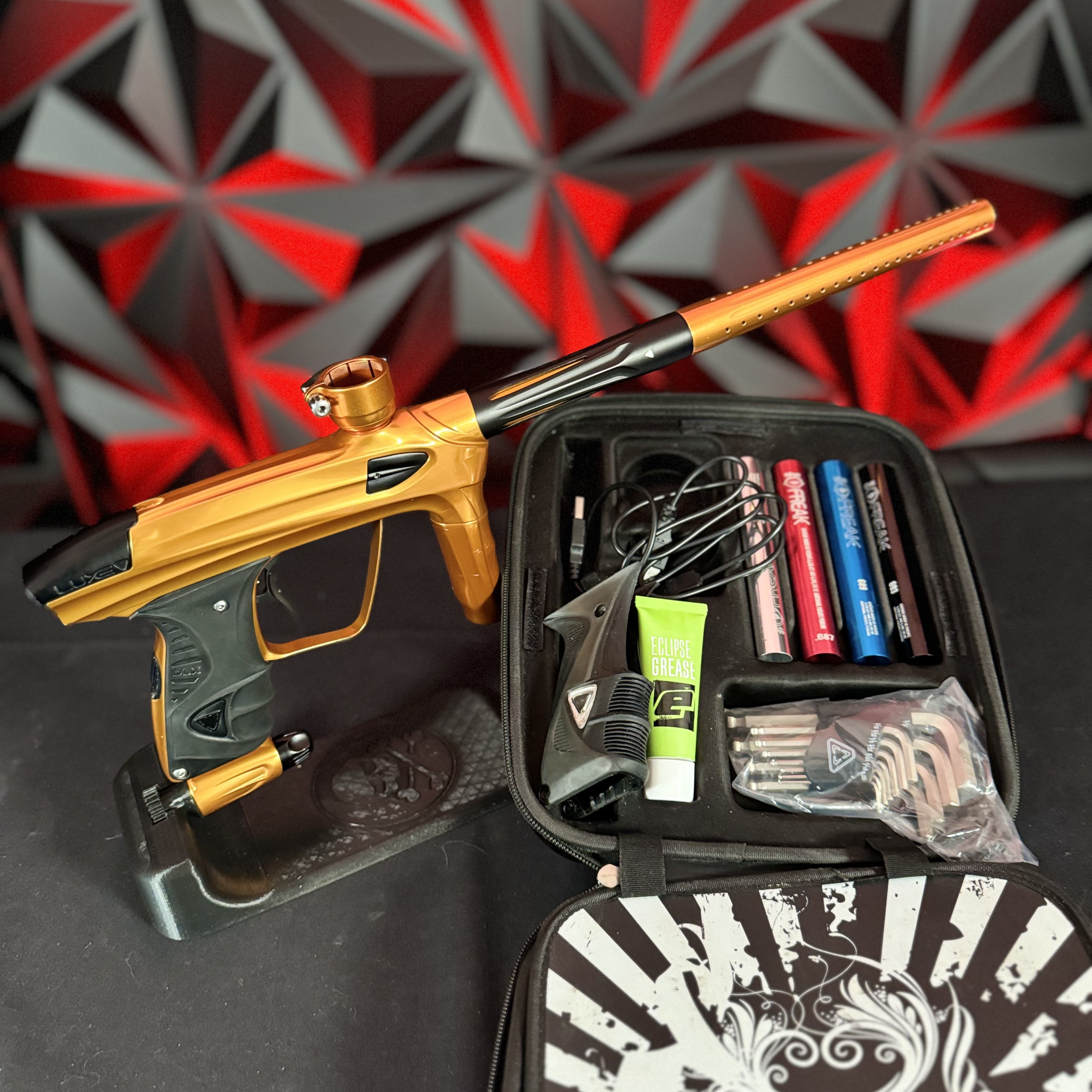 Used DLX Luxe 1.5 Paintball Gun - Polished Orange/Black w/2.0 Bolt