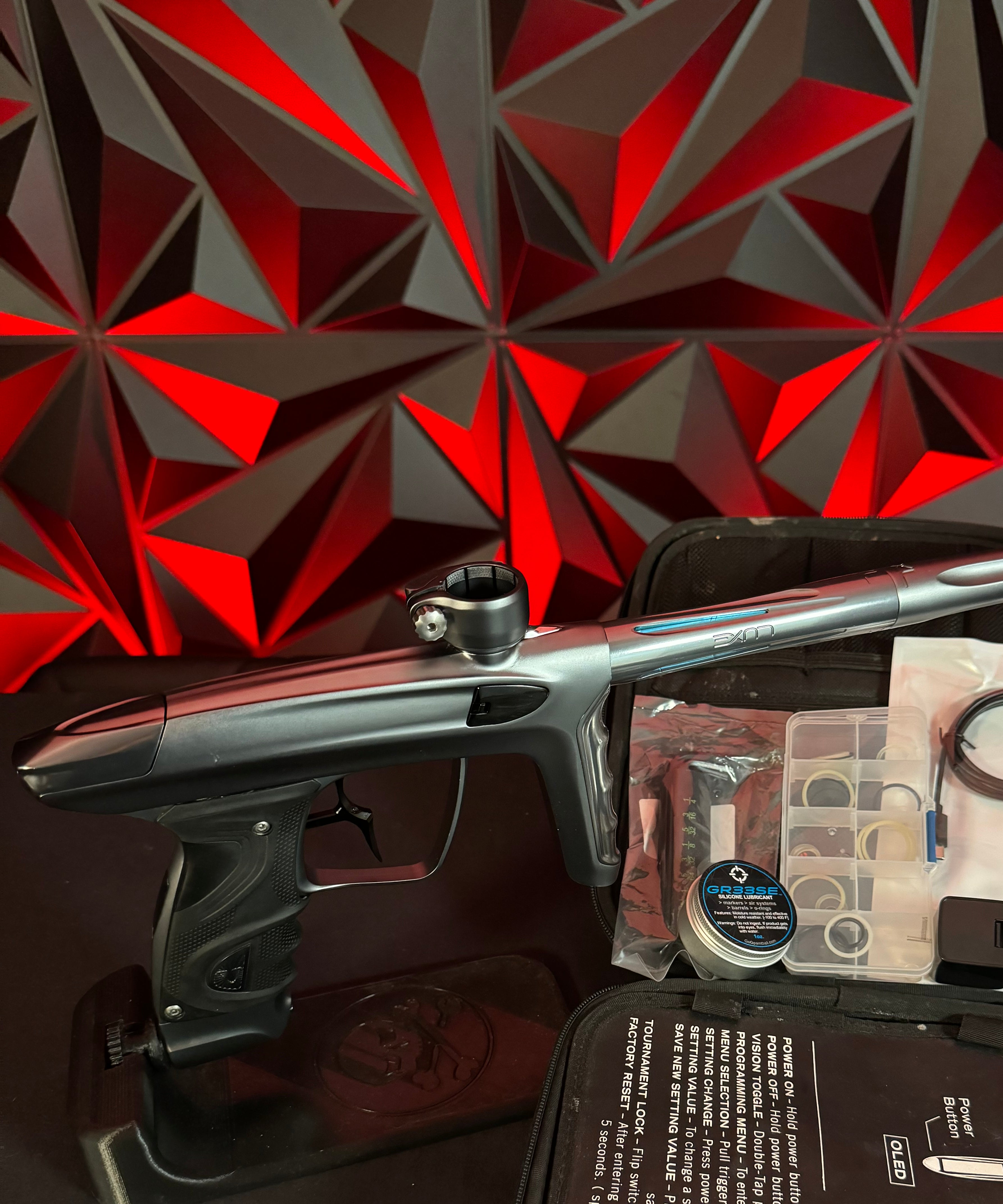 Used DLX TM40 Paintball Gun - Polished Pewter/Dust Pewter w/Infamous Deuce Trigger *Right side eye cover is Polished Black*