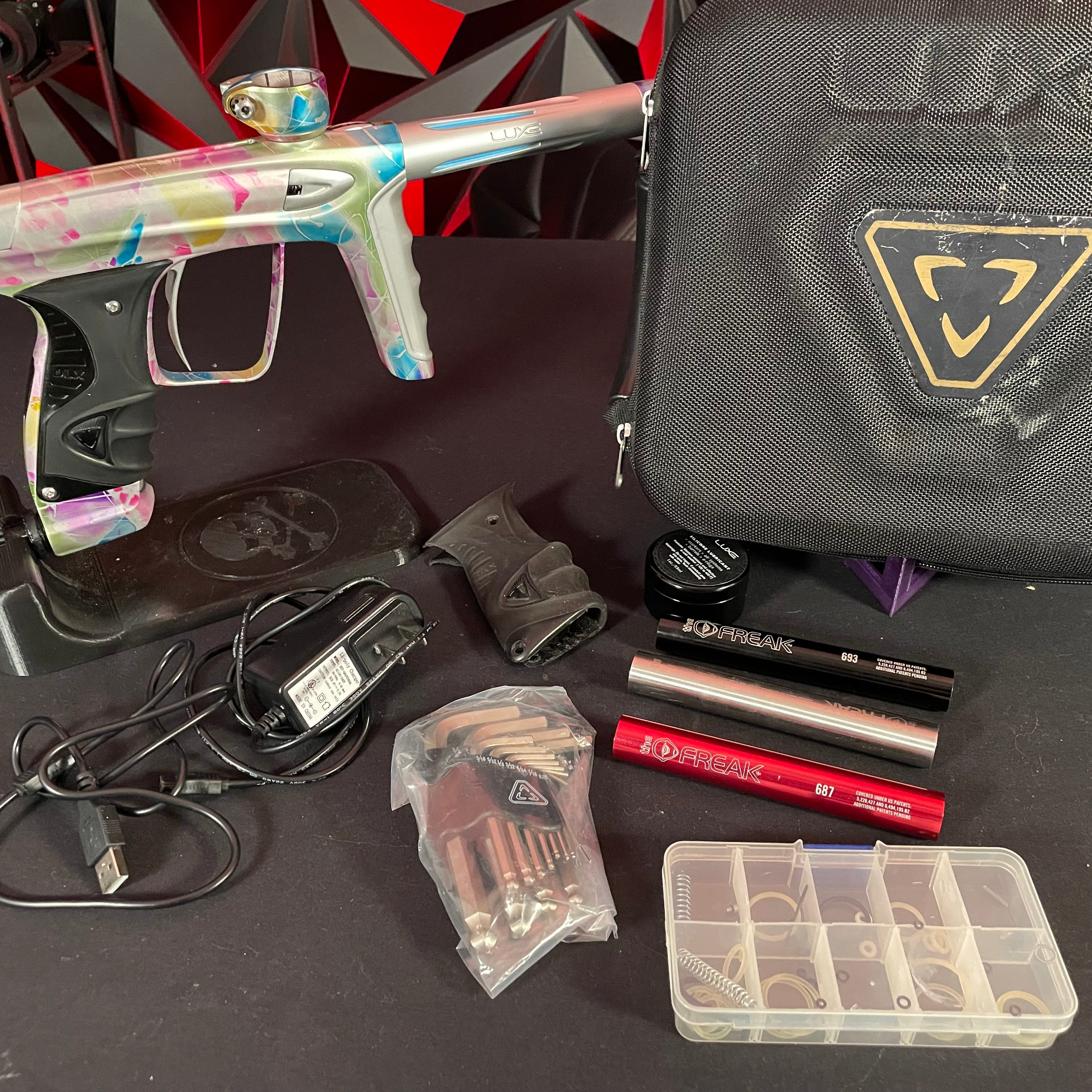Used DLX Luxe ICE Paintball Gun - Multi-Color Splash w/ 4 Freak Inserts
