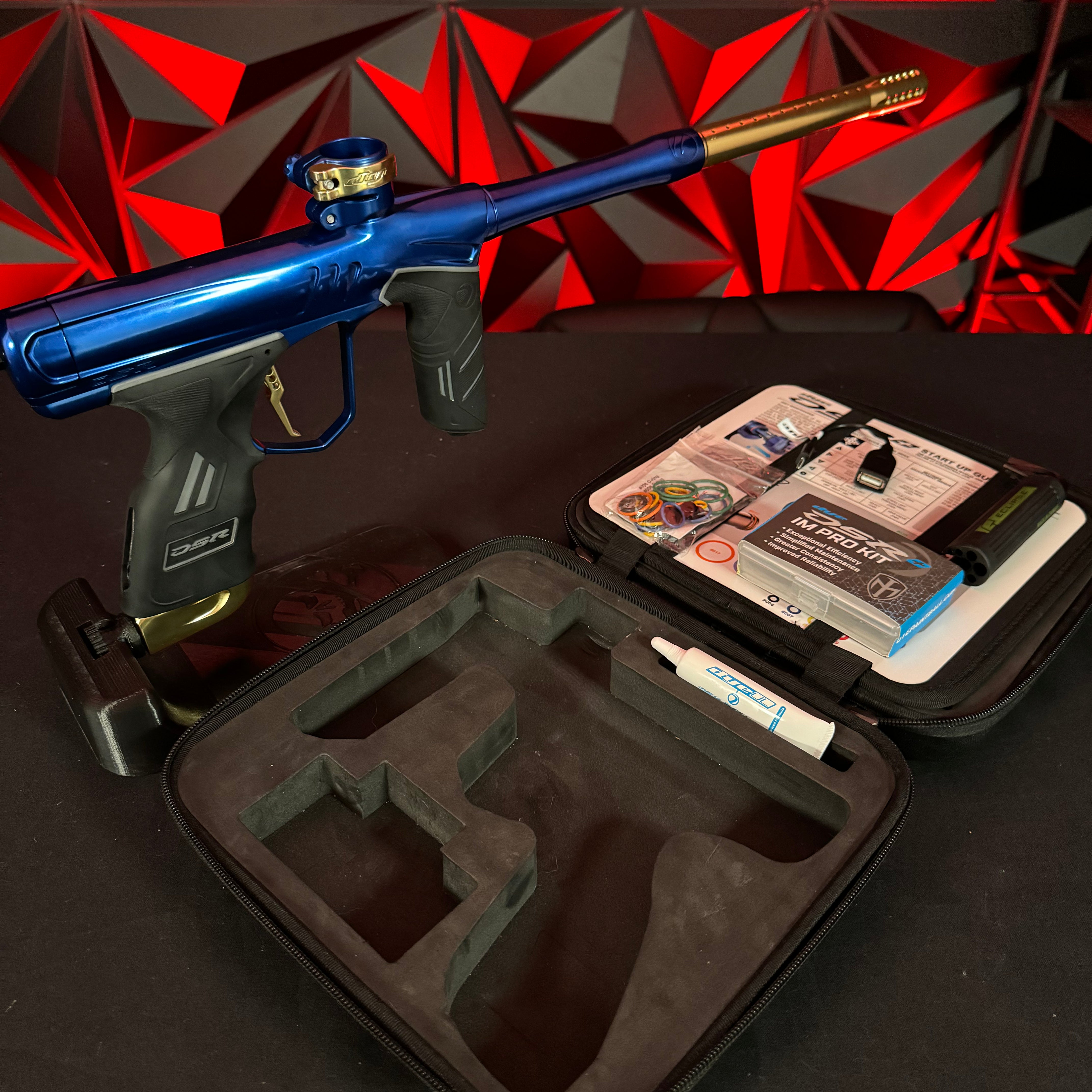 Used Dye DSR+ Paintball Gun - Polished Blue/Polished Gold w/ IM Pro Kit