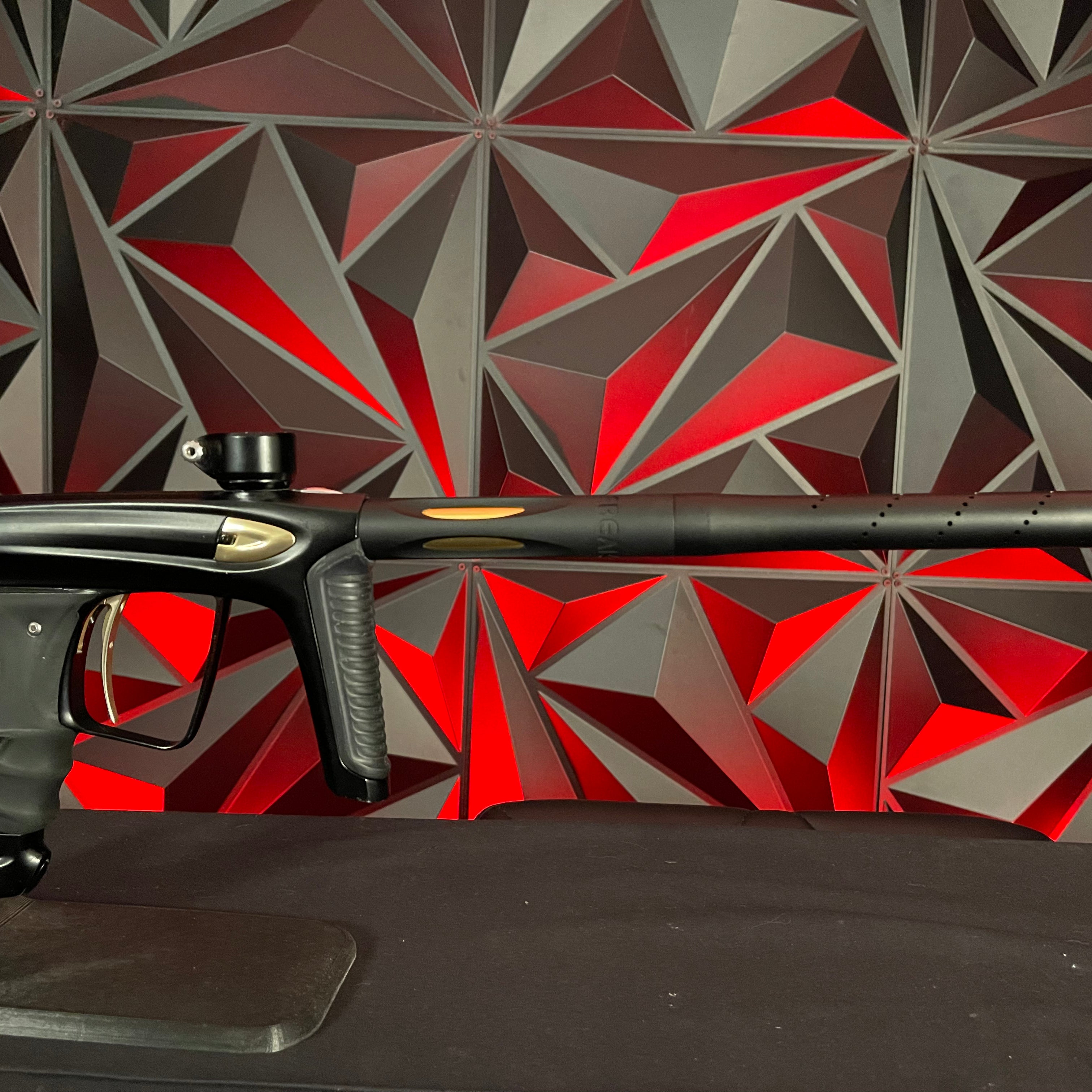 Used DLX Luxe Ice Paintball Gun - Dust Black / Polished Gold w/ Exalt Marker Case