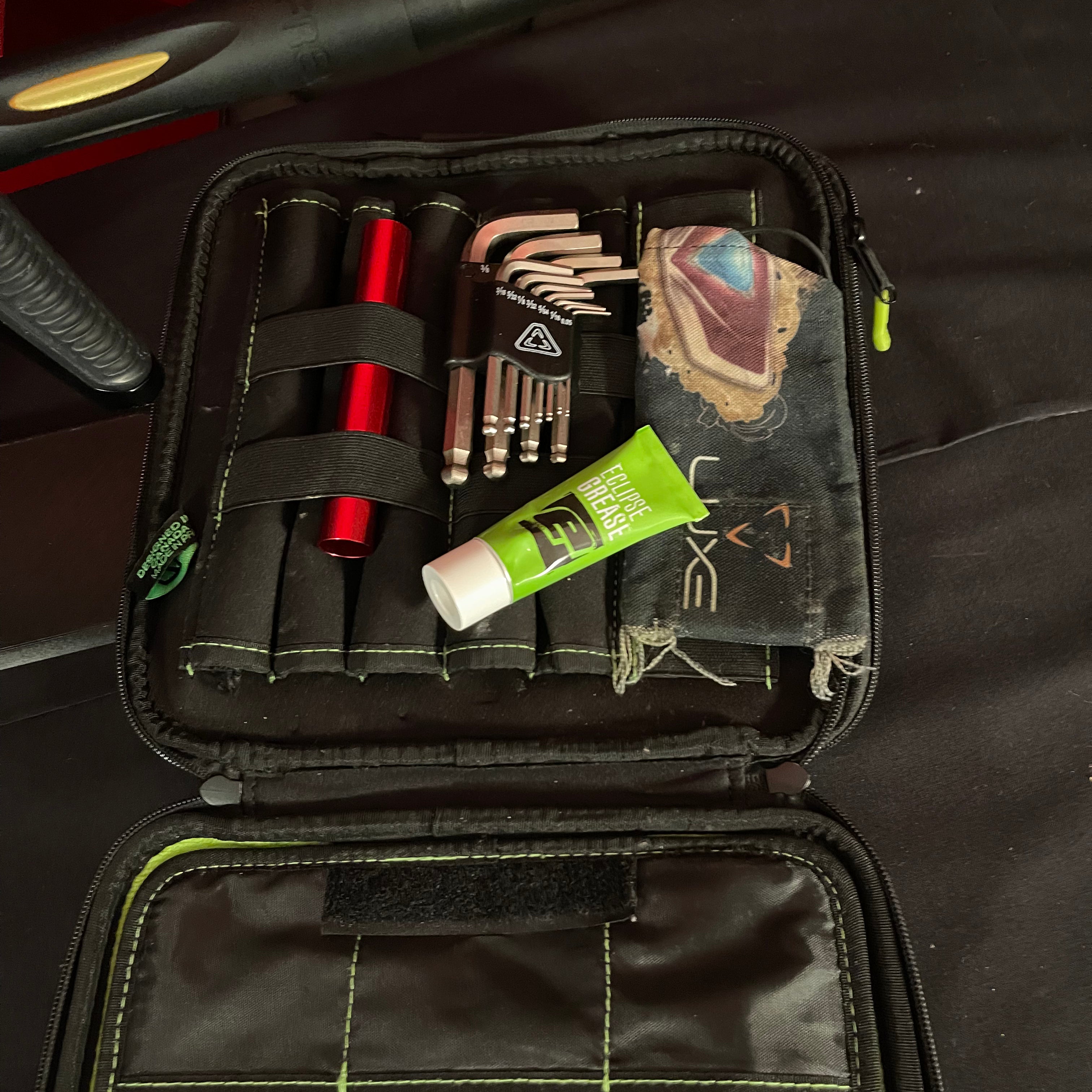 Used DLX Luxe Ice Paintball Gun - Dust Black / Polished Gold w/ Exalt Marker Case