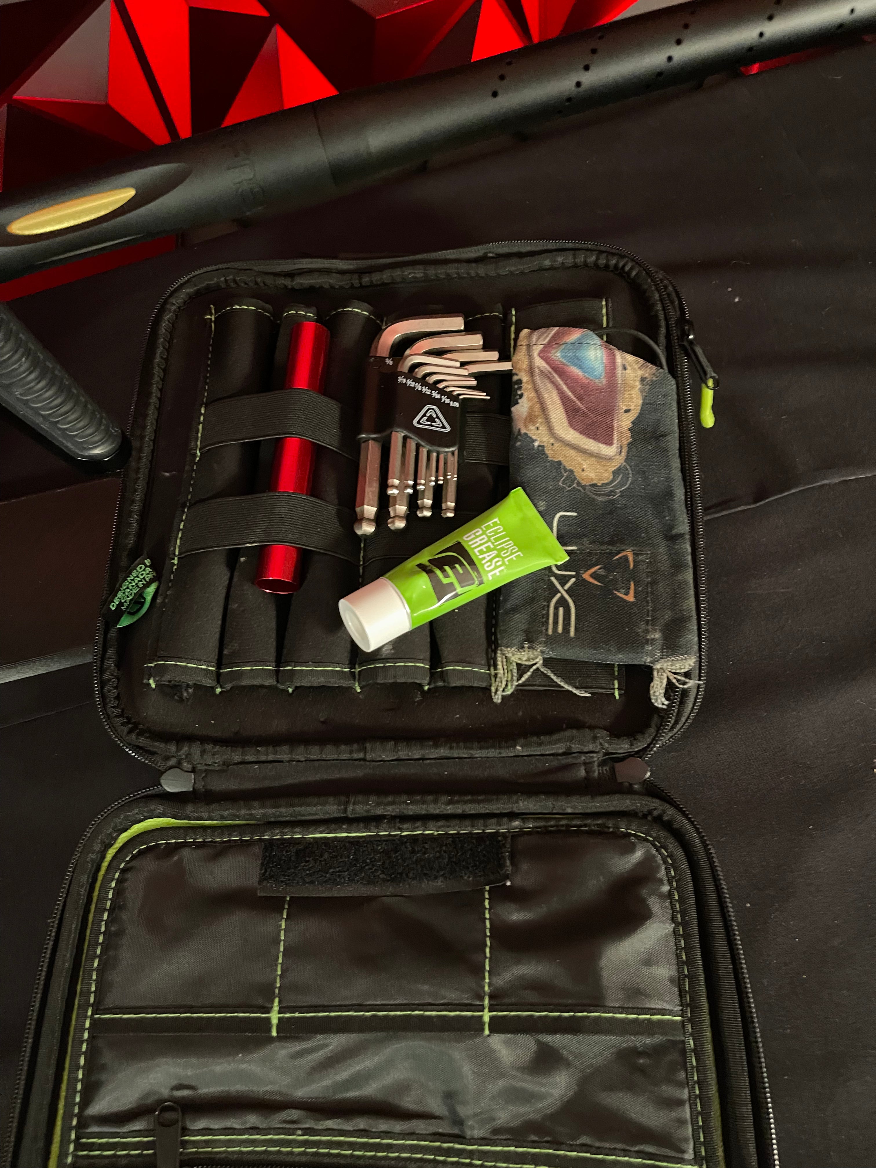 Used DLX Luxe Ice Paintball Gun - Dust Black / Polished Gold w/ Exalt Marker Case