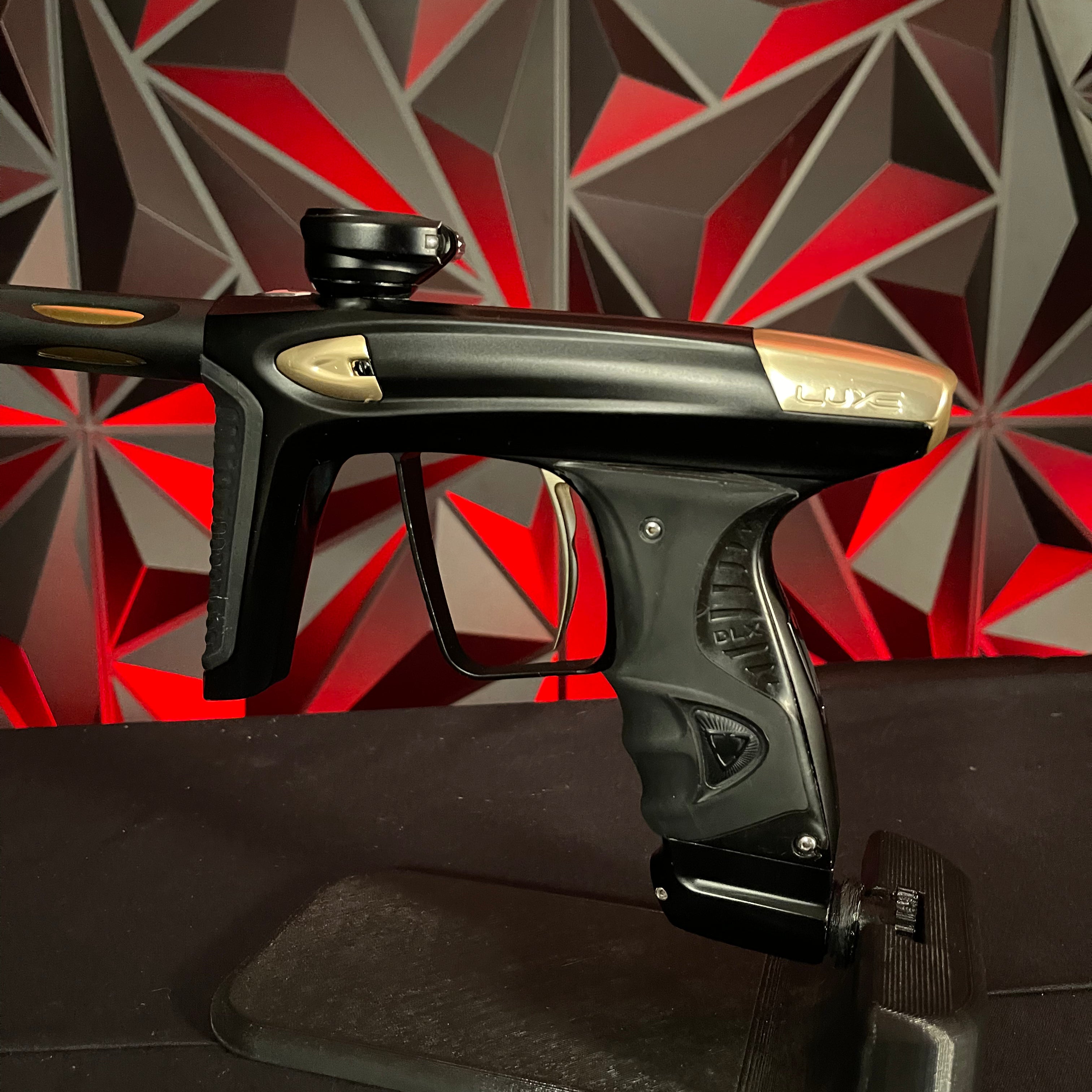 Used DLX Luxe Ice Paintball Gun - Dust Black / Polished Gold w/ Exalt Marker Case