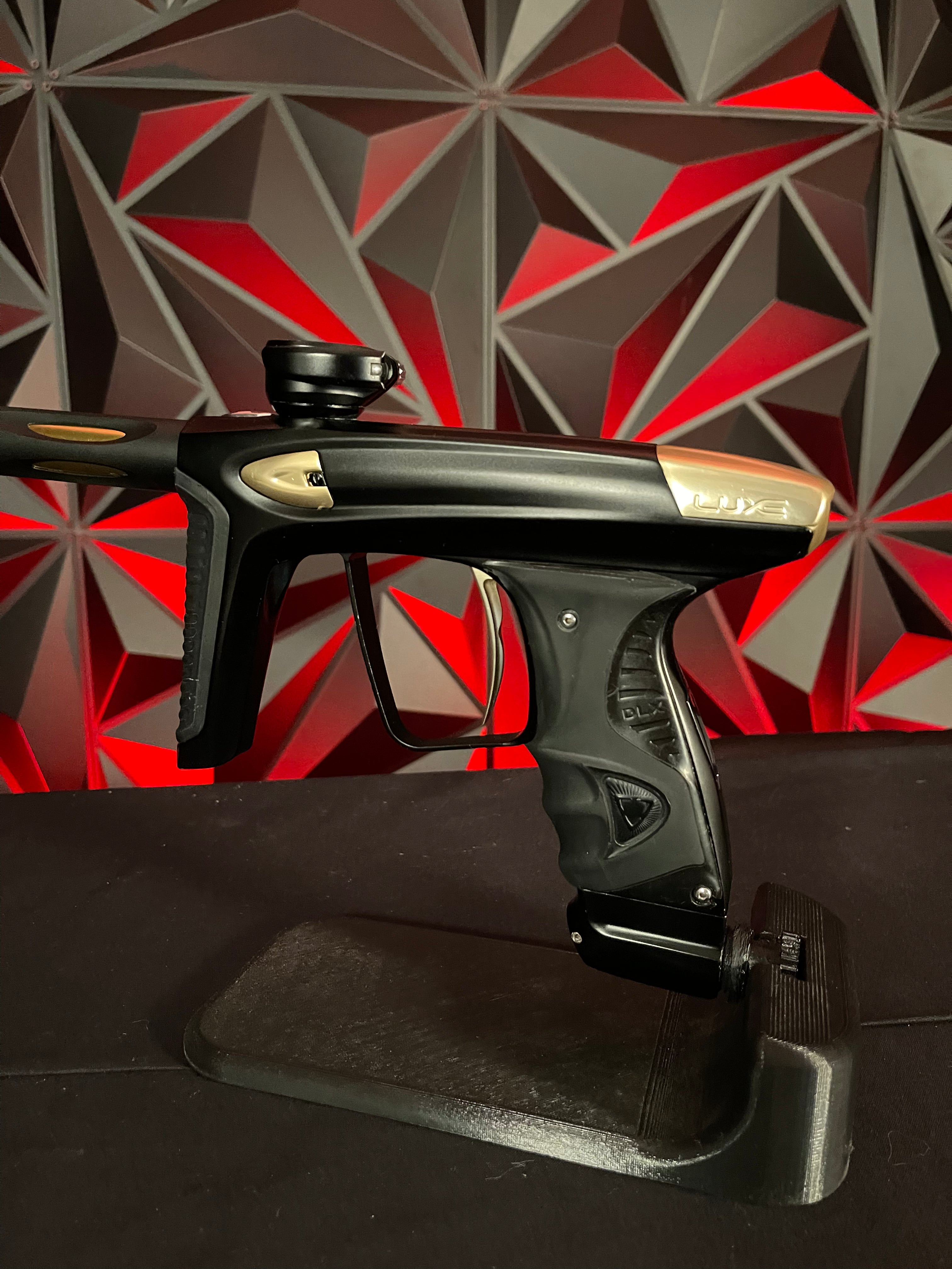 Used DLX Luxe Ice Paintball Gun - Dust Black / Polished Gold w/ Exalt Marker Case