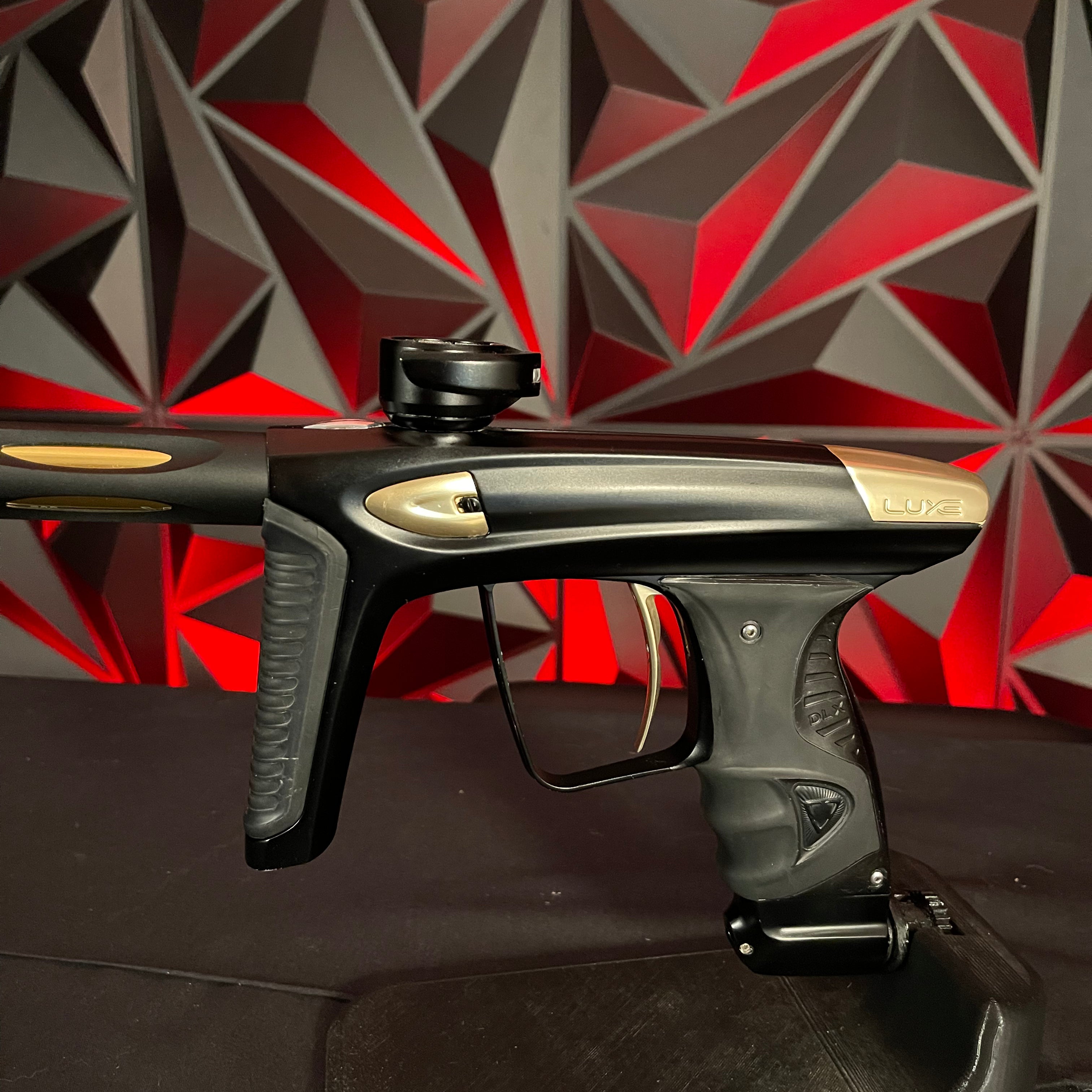 Used DLX Luxe Ice Paintball Gun - Dust Black / Polished Gold w/ Exalt Marker Case