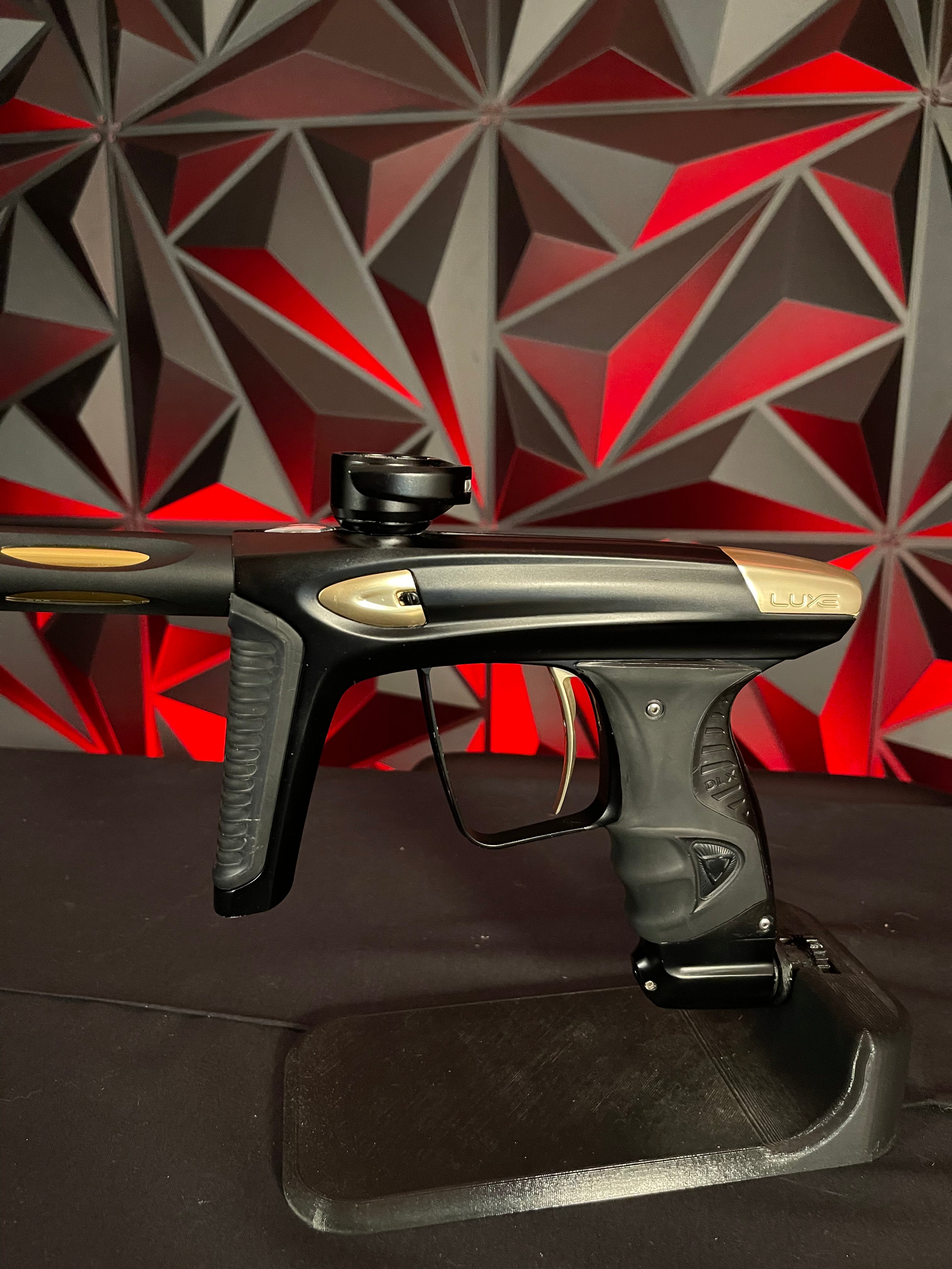 Used DLX Luxe Ice Paintball Gun - Dust Black / Polished Gold w/ Exalt Marker Case