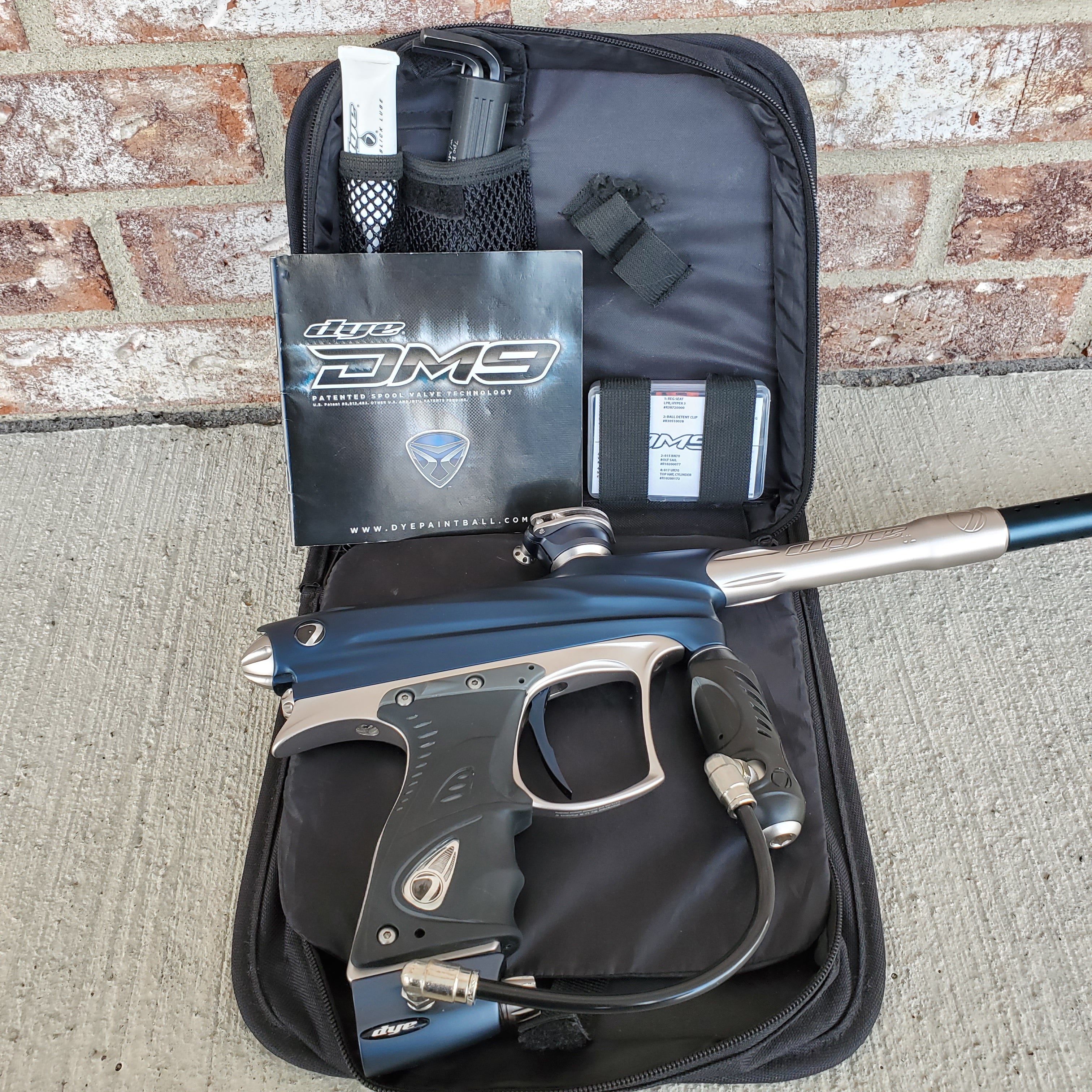 Used Dye DM9 Paintball Marker - Blue / Silver