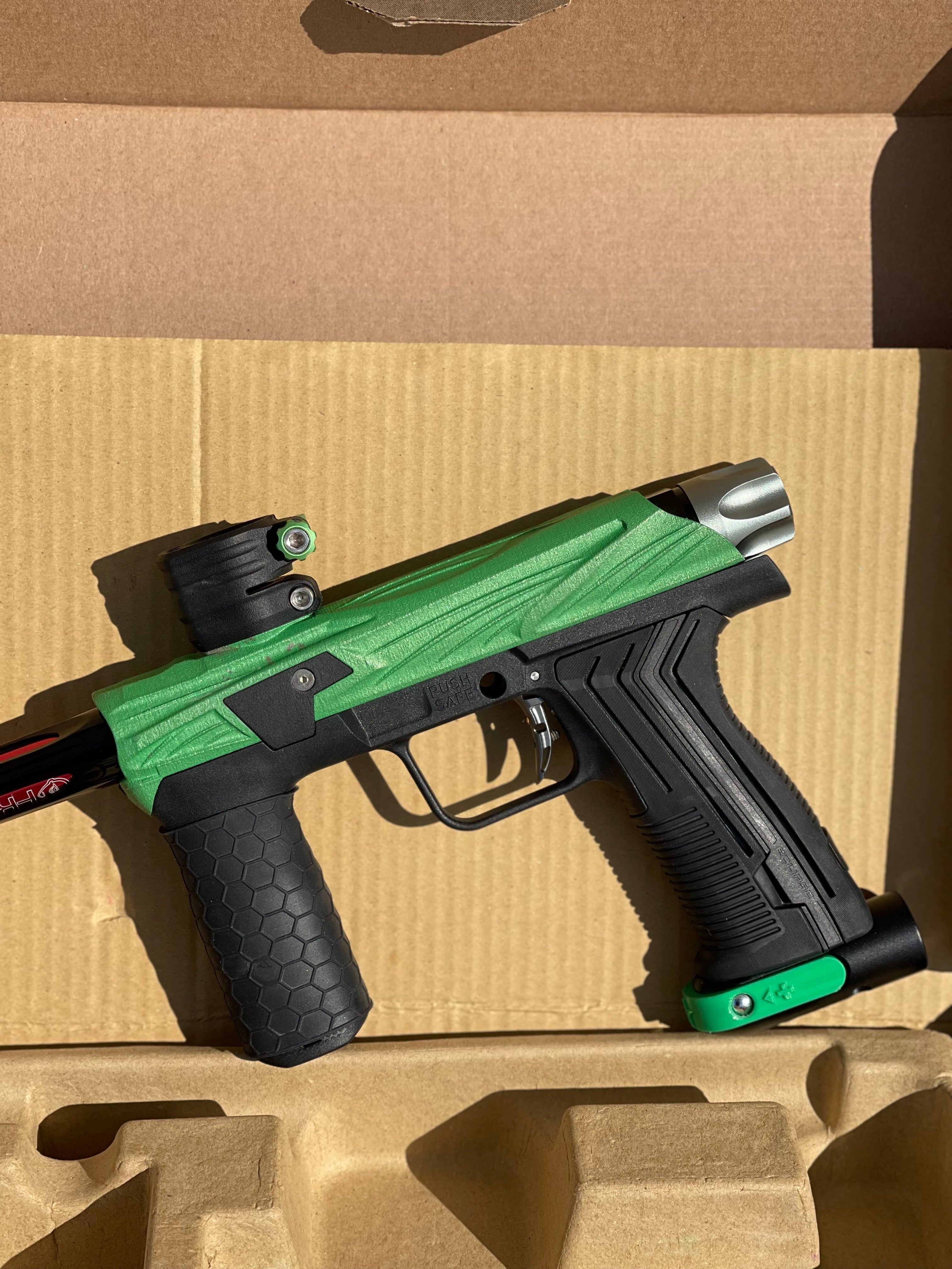 Used Planet Eclipse Emek 100 Paintball Gun - Green - Custom Body w/ Infamous Murder Trigger w/ Freak XL Barrel Kit, Hair 45 Trigger Valve, POPS ASA, Exalt Back Cap, Exalt Feedneck Lever, Rubber Front Grip Sleeve