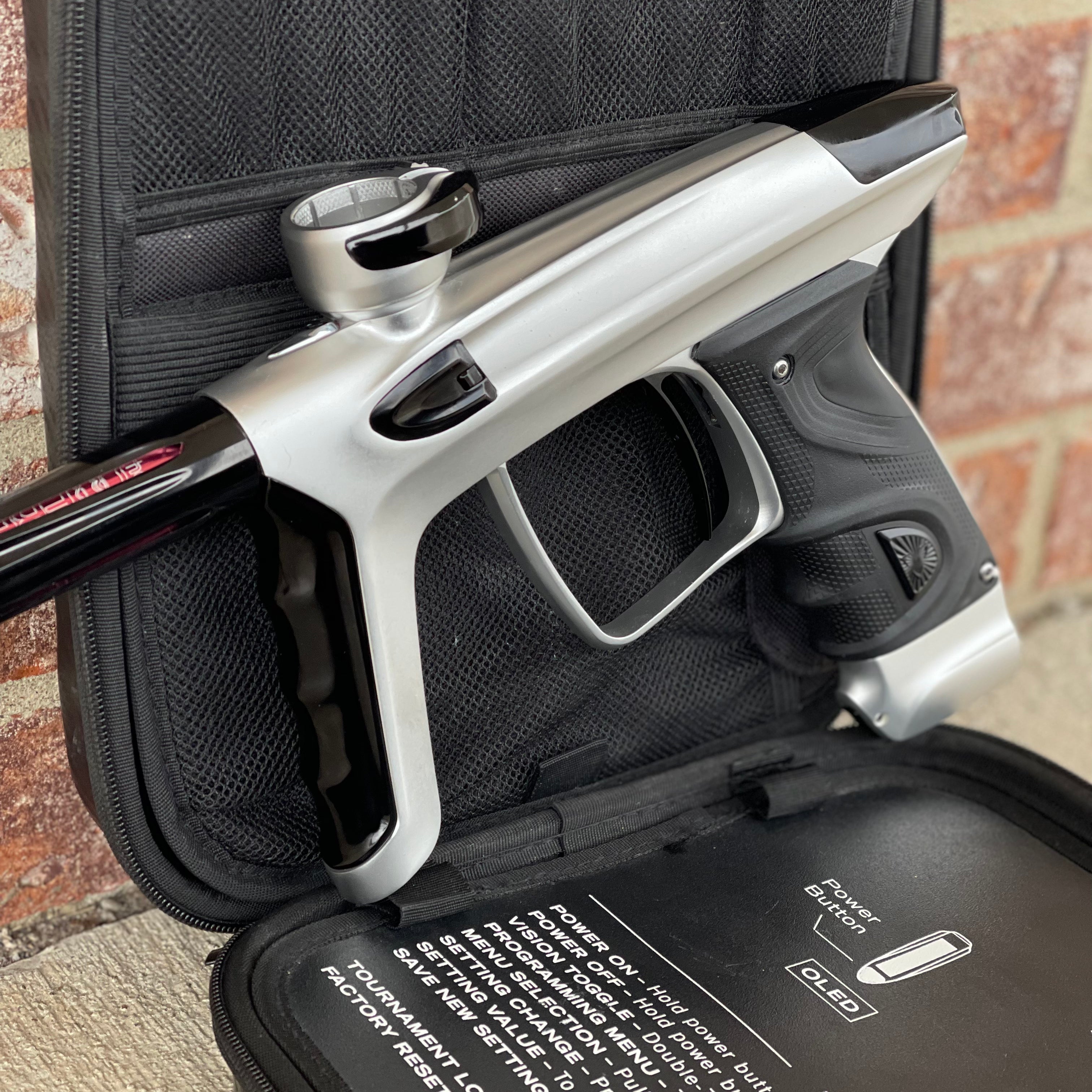 Used DLX Luxe TM40 Paintball Gun - Dust Silver/Gloss Black w/ Stock Bolt and SSC Bolt