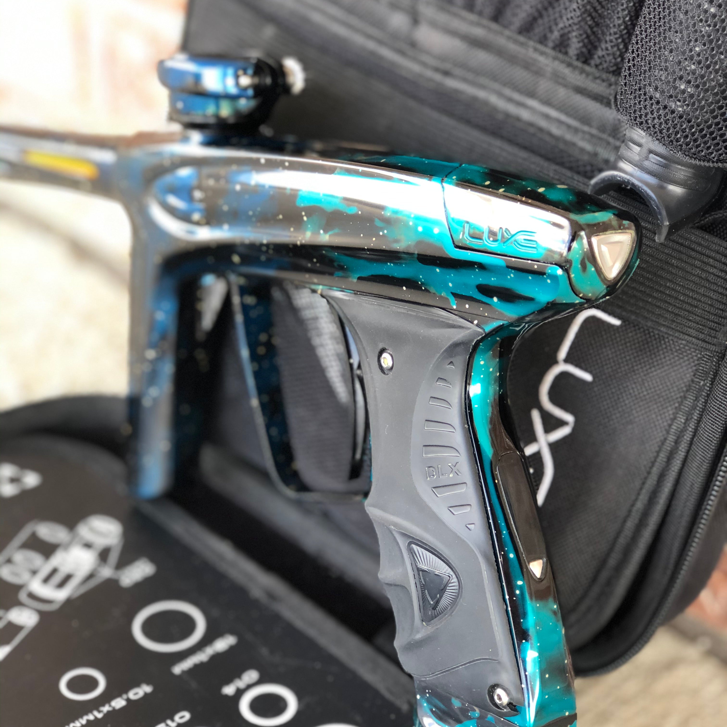 Used DLX Luxe Ice Paintball Gun - Galaxy Teal/Black/Blue