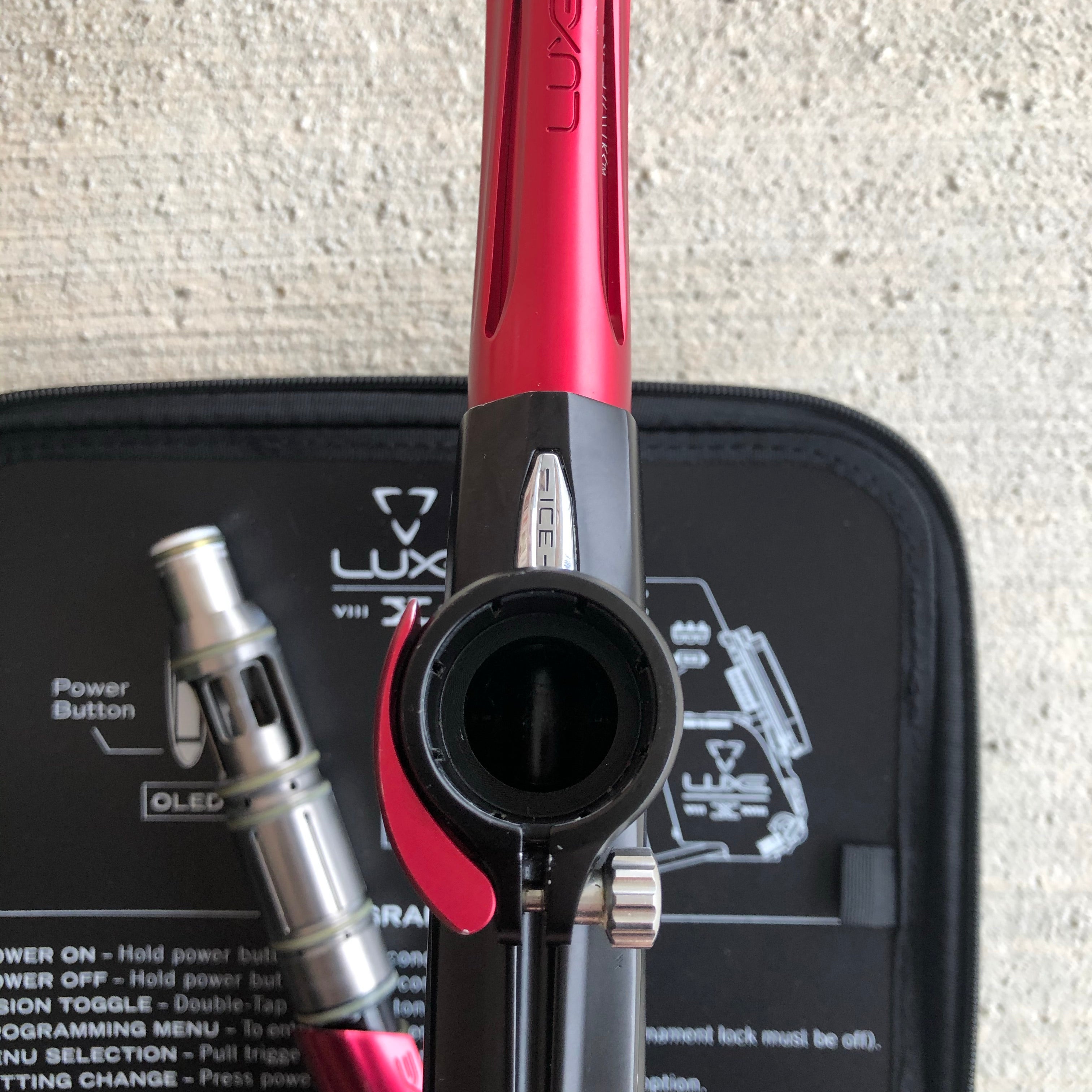 Used DLX Luxe Ice Paintball Gun - Black/Red w/ Aftermath Lazering