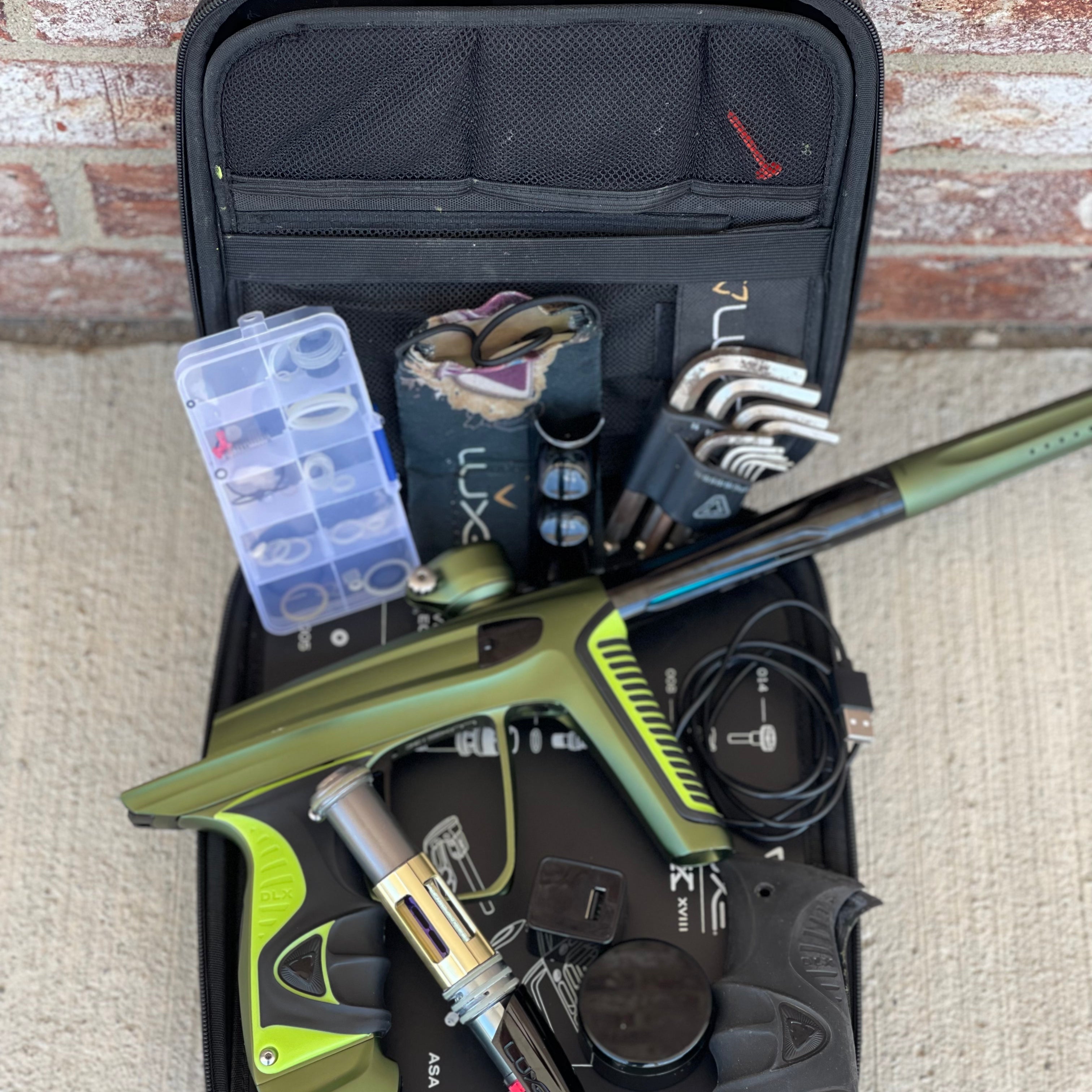 Used DLX Luxe X Paintball Gun - Dust Olive/Polished Black w/ Green Grip Kit