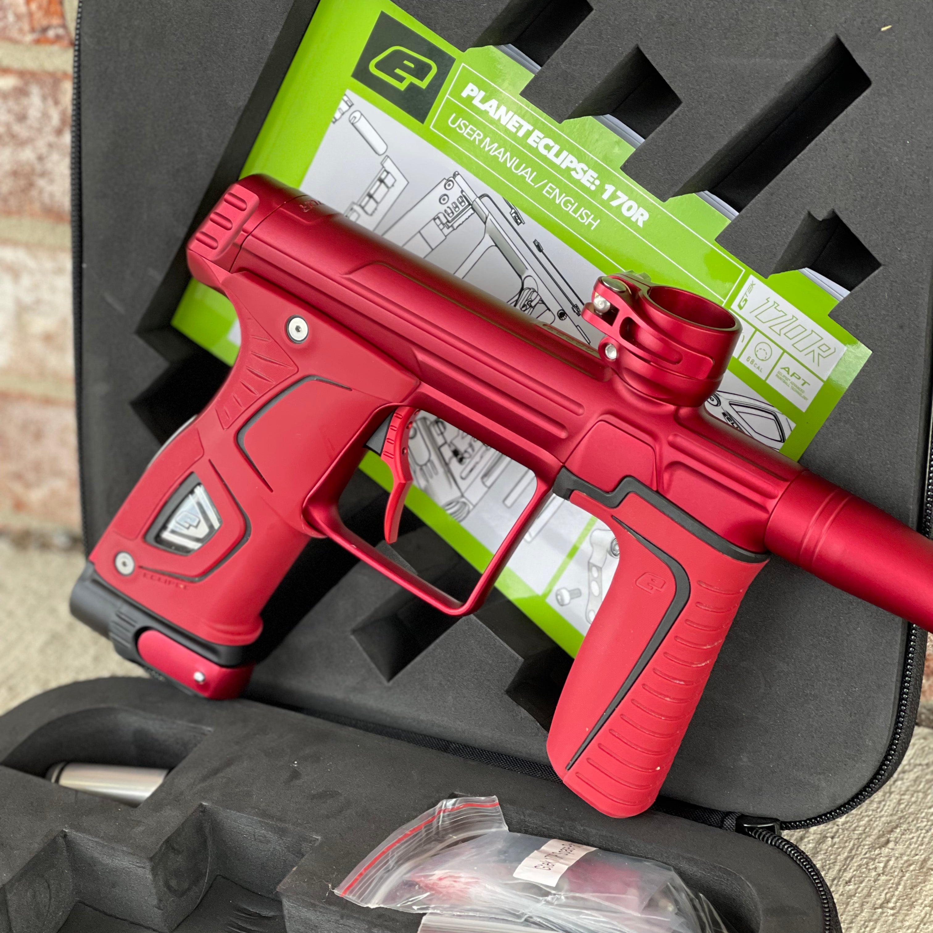 Used Planet Eclipse 170R Paintball Gun - Dust Red w/Red Grip Kit, Deuce Trigger, and ST3 Bolt