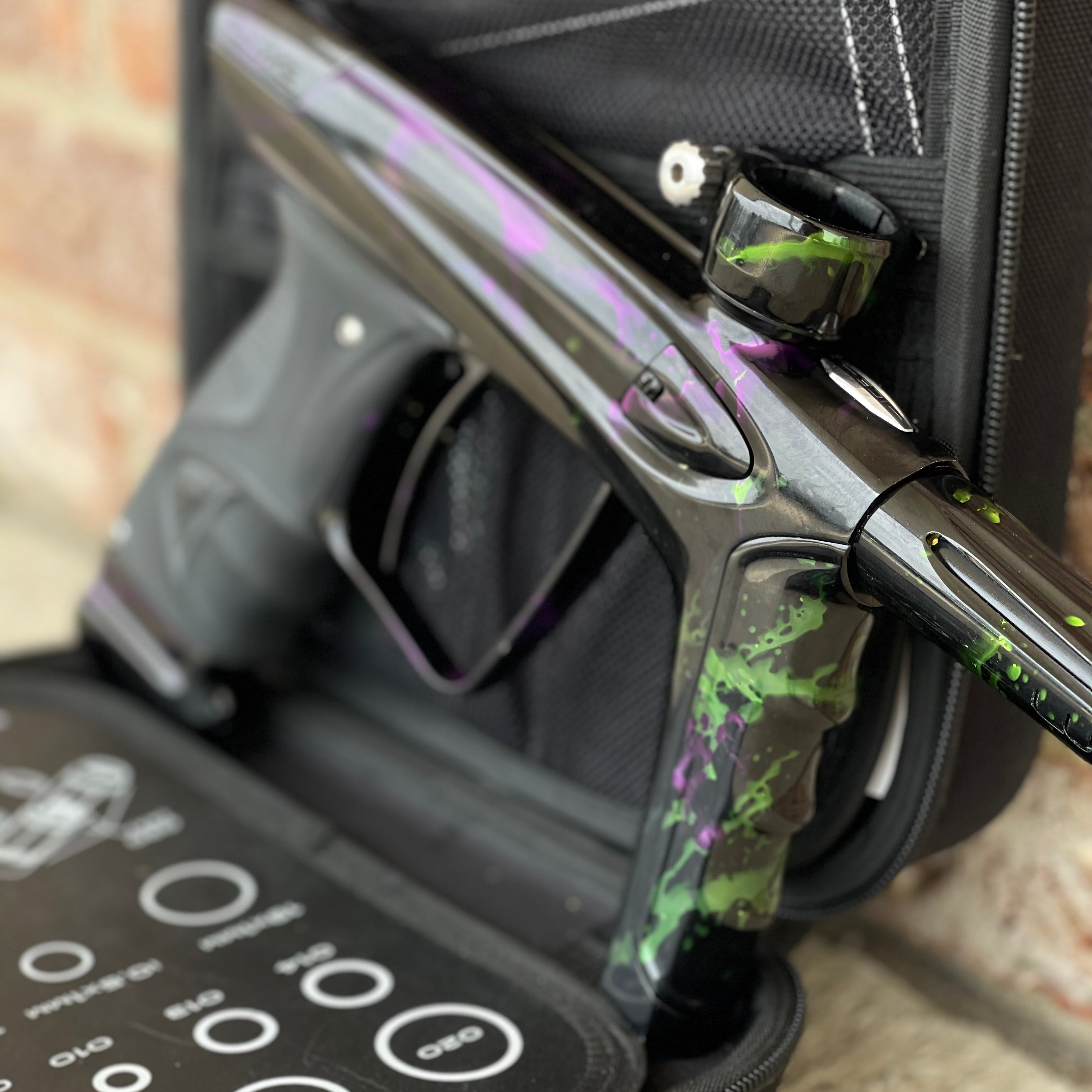 Used DLX Luxe Ice Paintball Gun - Acid Wash Green / Purple