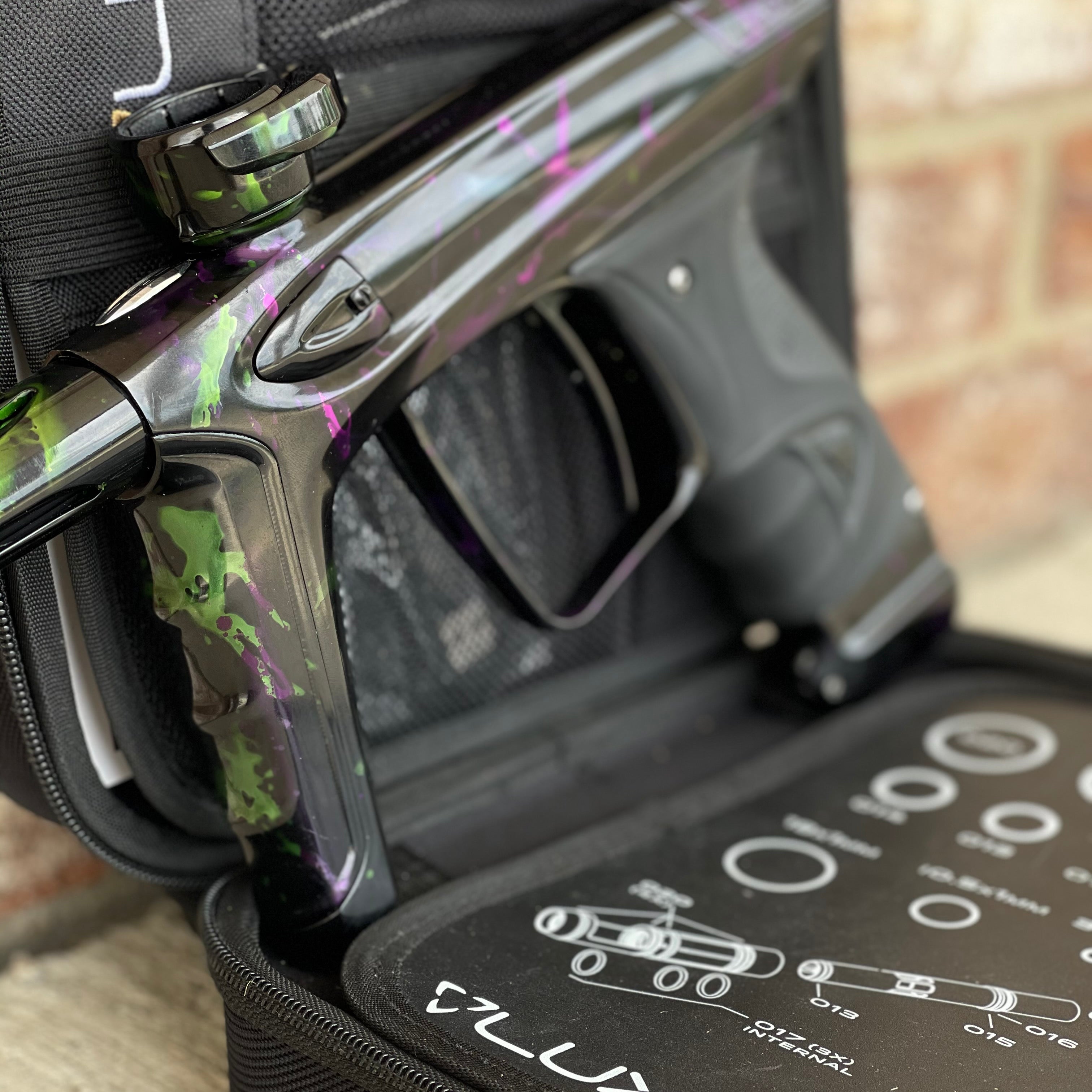 Used DLX Luxe Ice Paintball Gun - Acid Wash Green / Purple