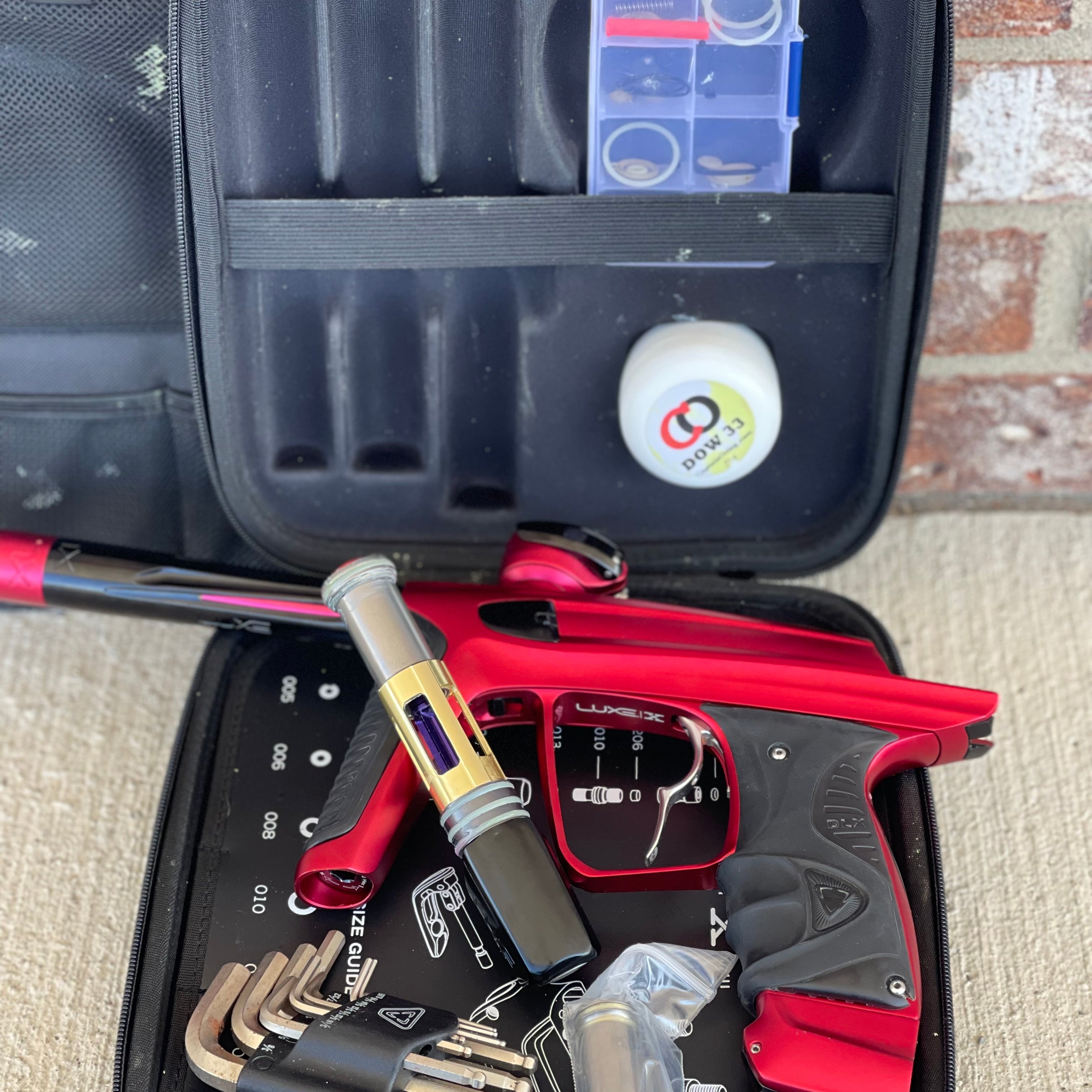 Used DLX Luxe X Paintball Gun - Dust Red w/ Infamous Deuce Trigger