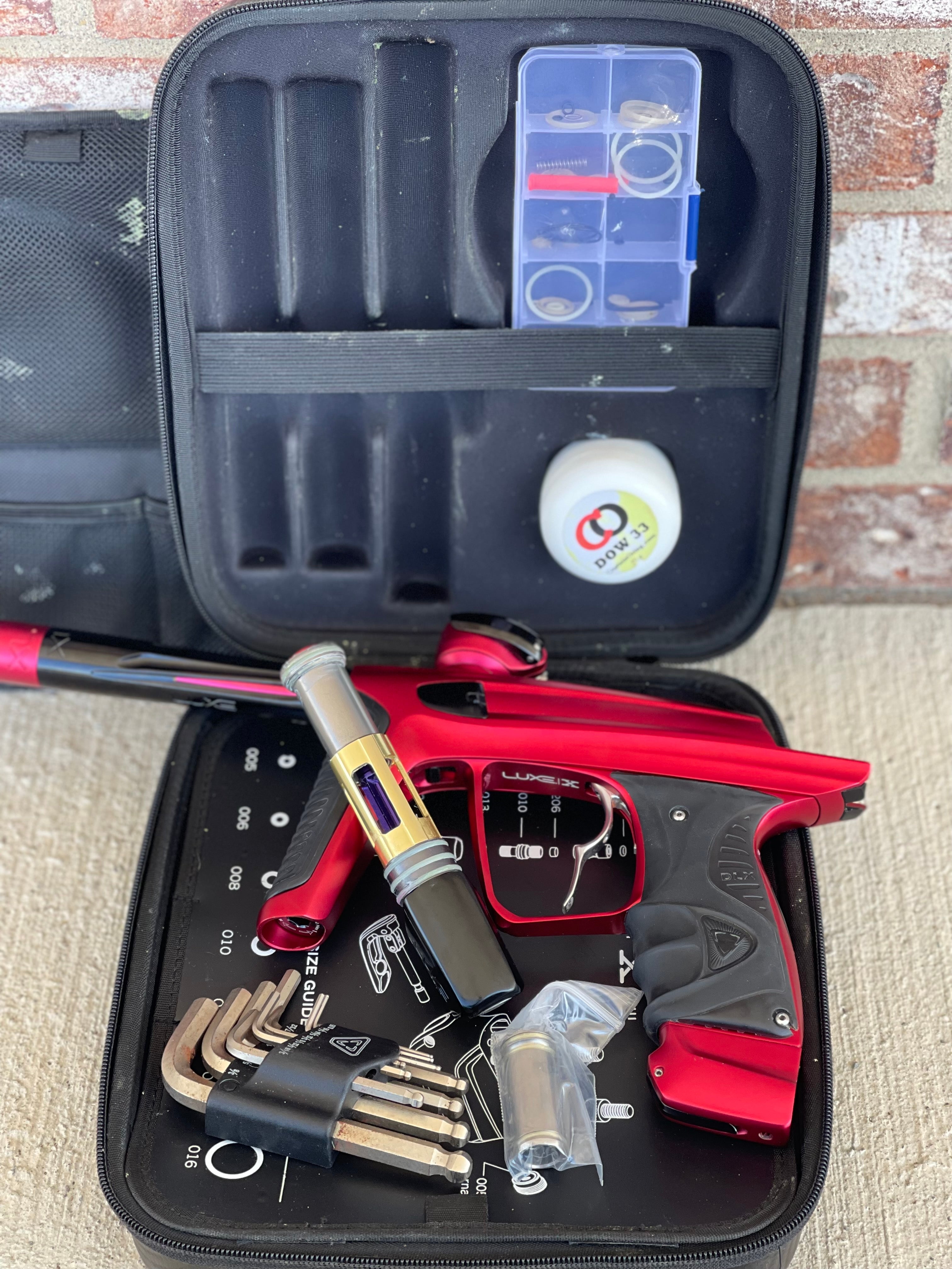 Used DLX Luxe X Paintball Gun - Dust Red w/ Infamous Deuce Trigger