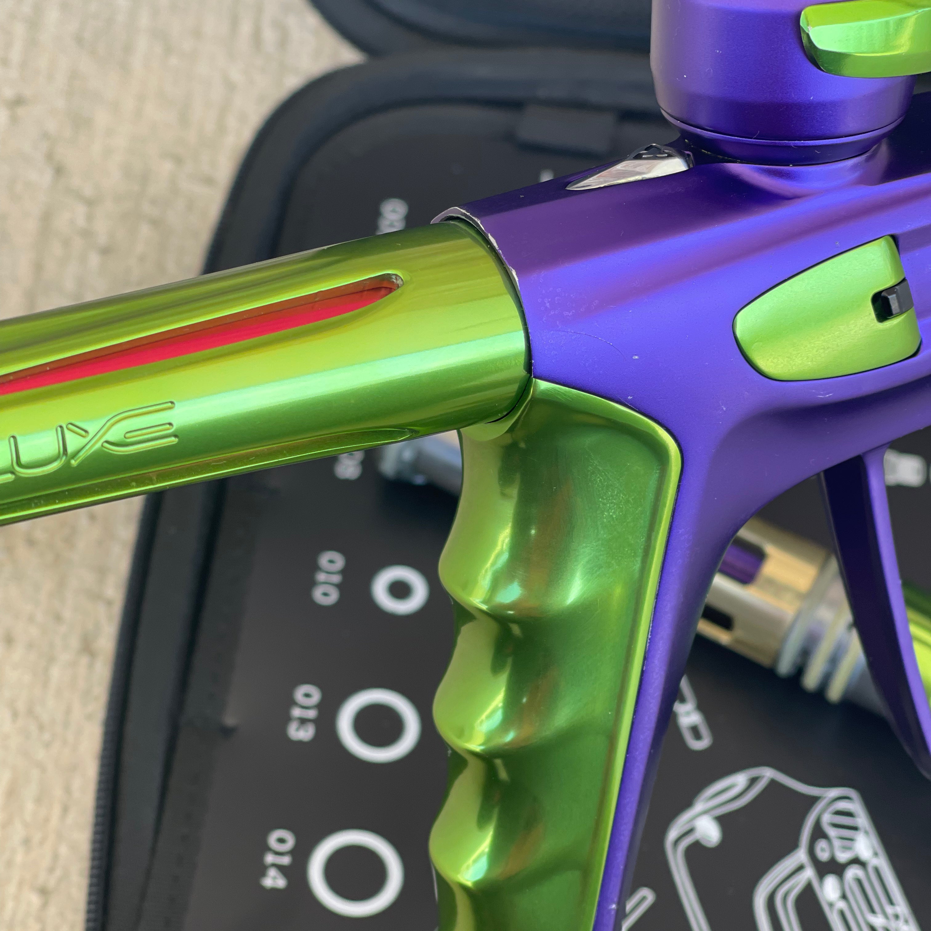 Used DLX Luxe X Paintball Gun - Dust Purple / Polished Green