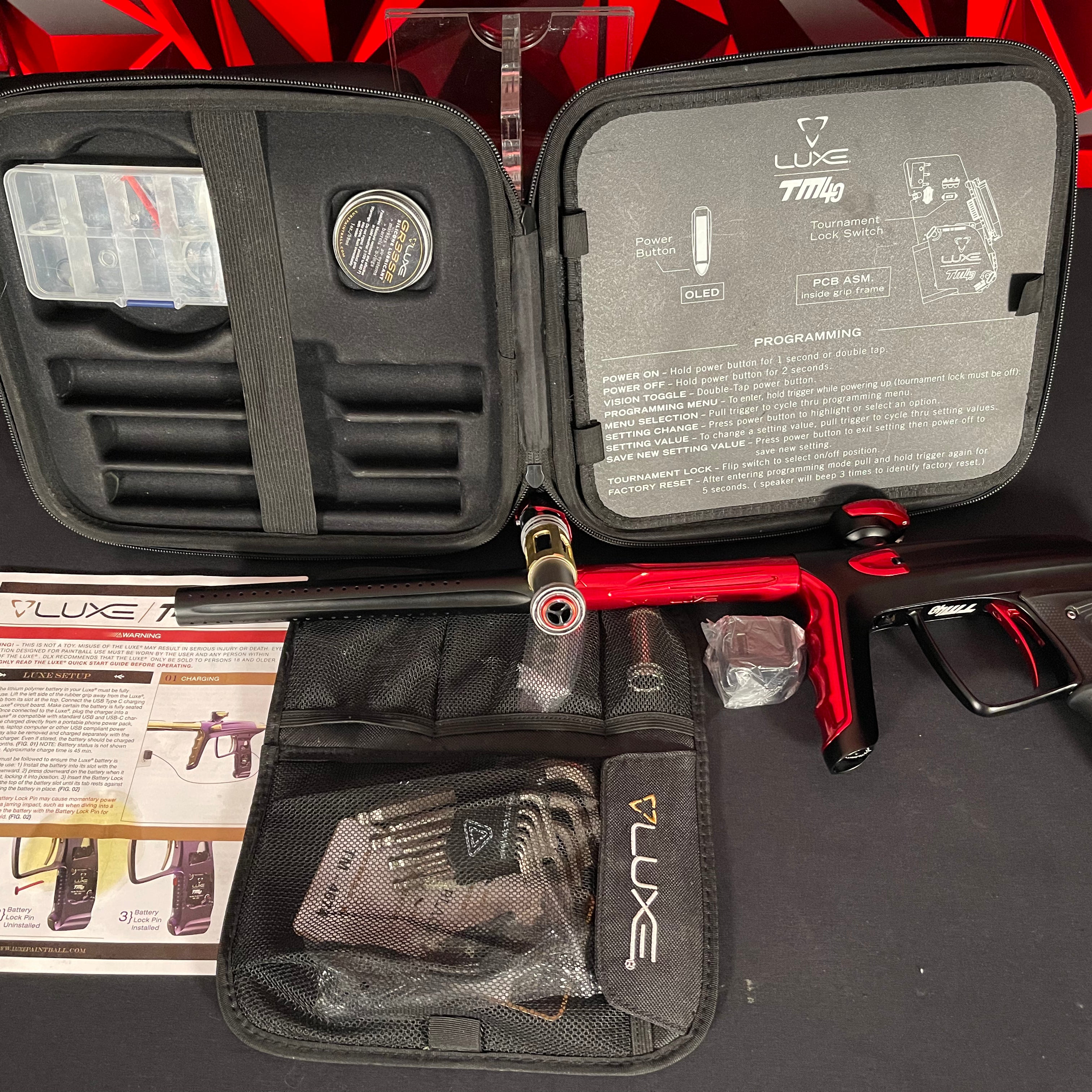 Used DLX Luxe TM40 Paintball Gun - Dust Black/Gloss Red
