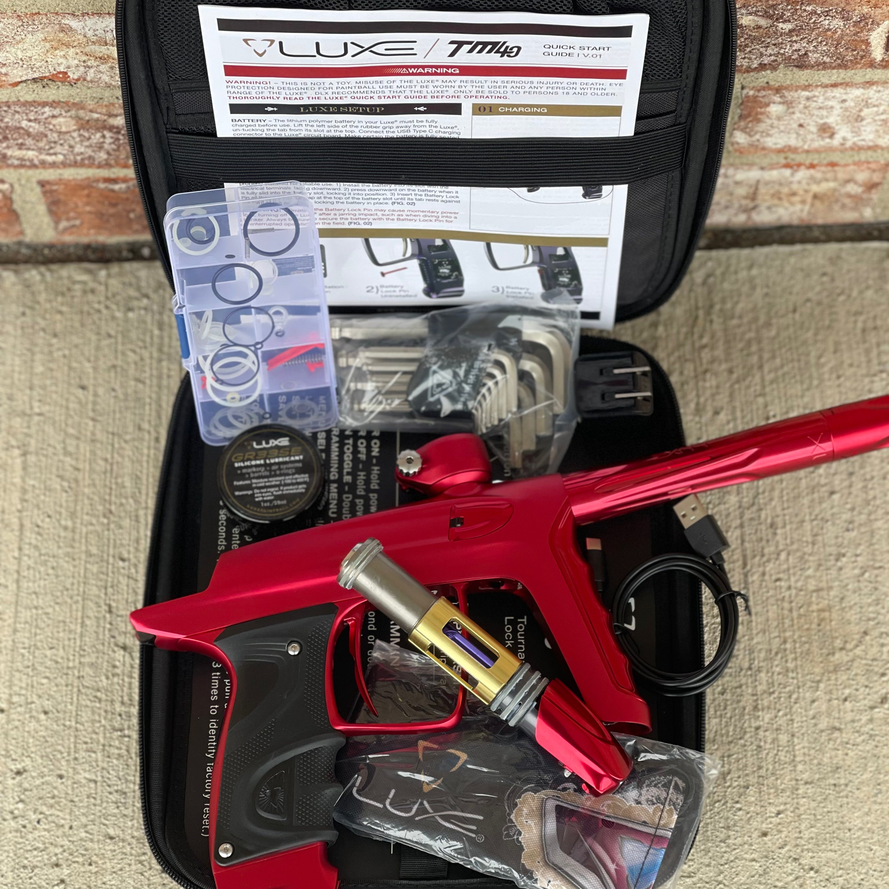 Used DLX Luxe TM40 Paintball Gun - Dust Red / Gloss Red