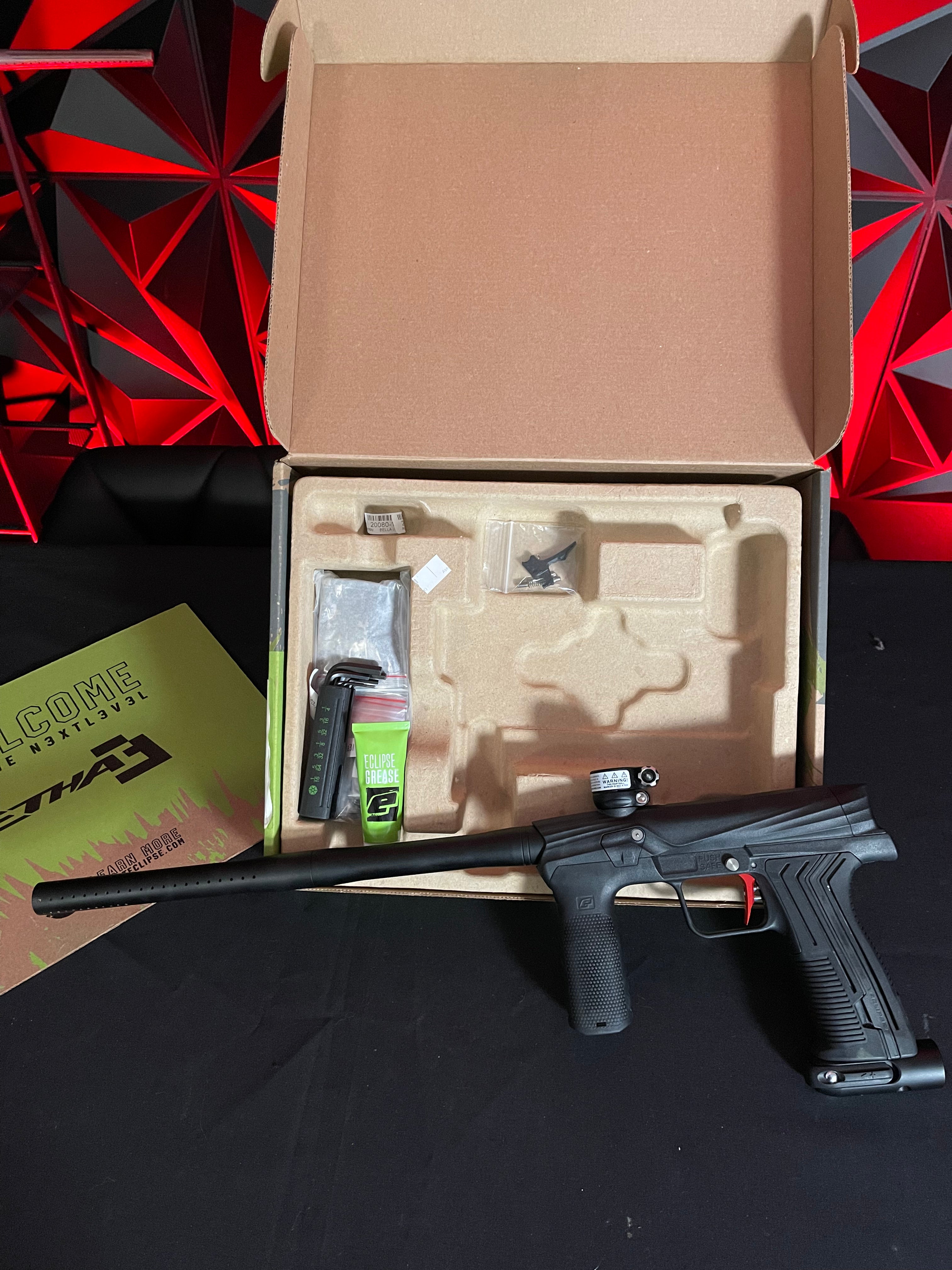 Used Planet Eclipse Etha 3M Paintball Marker - Black w/ Red Fang Trigger