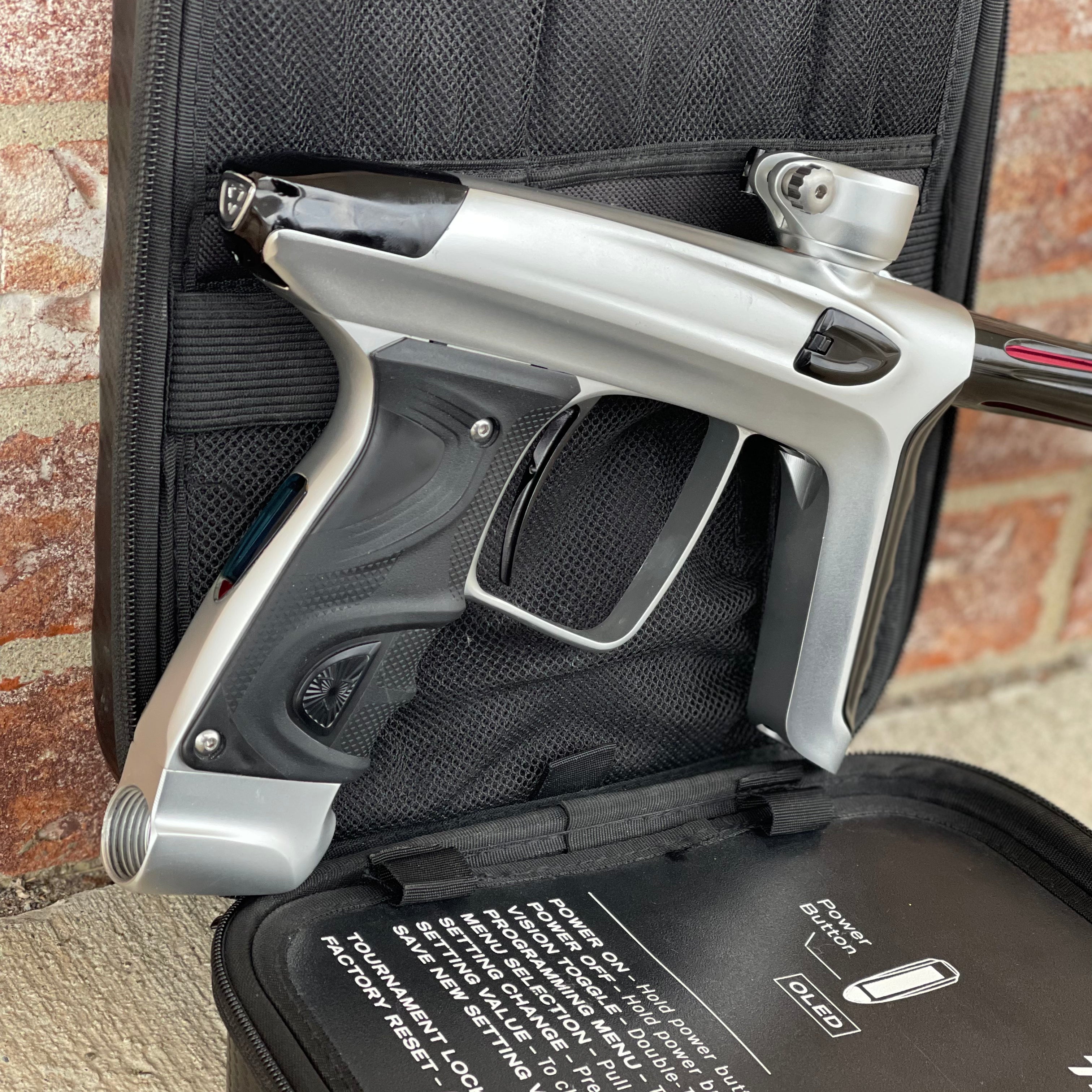 Used DLX Luxe TM40 Paintball Gun - Dust Silver/Gloss Black w/ Stock Bolt and SSC Bolt