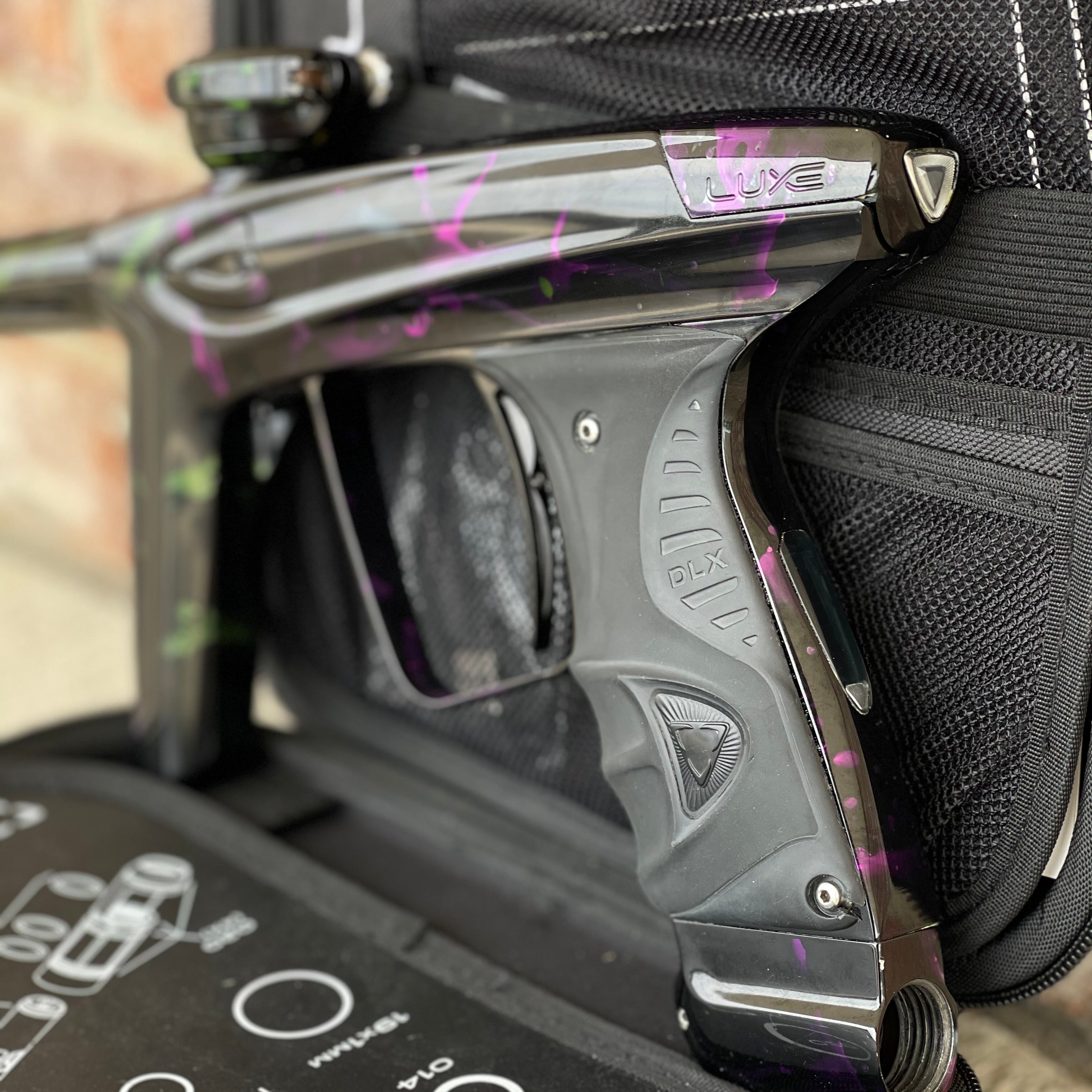 Used DLX Luxe Ice Paintball Gun - Acid Wash Green / Purple