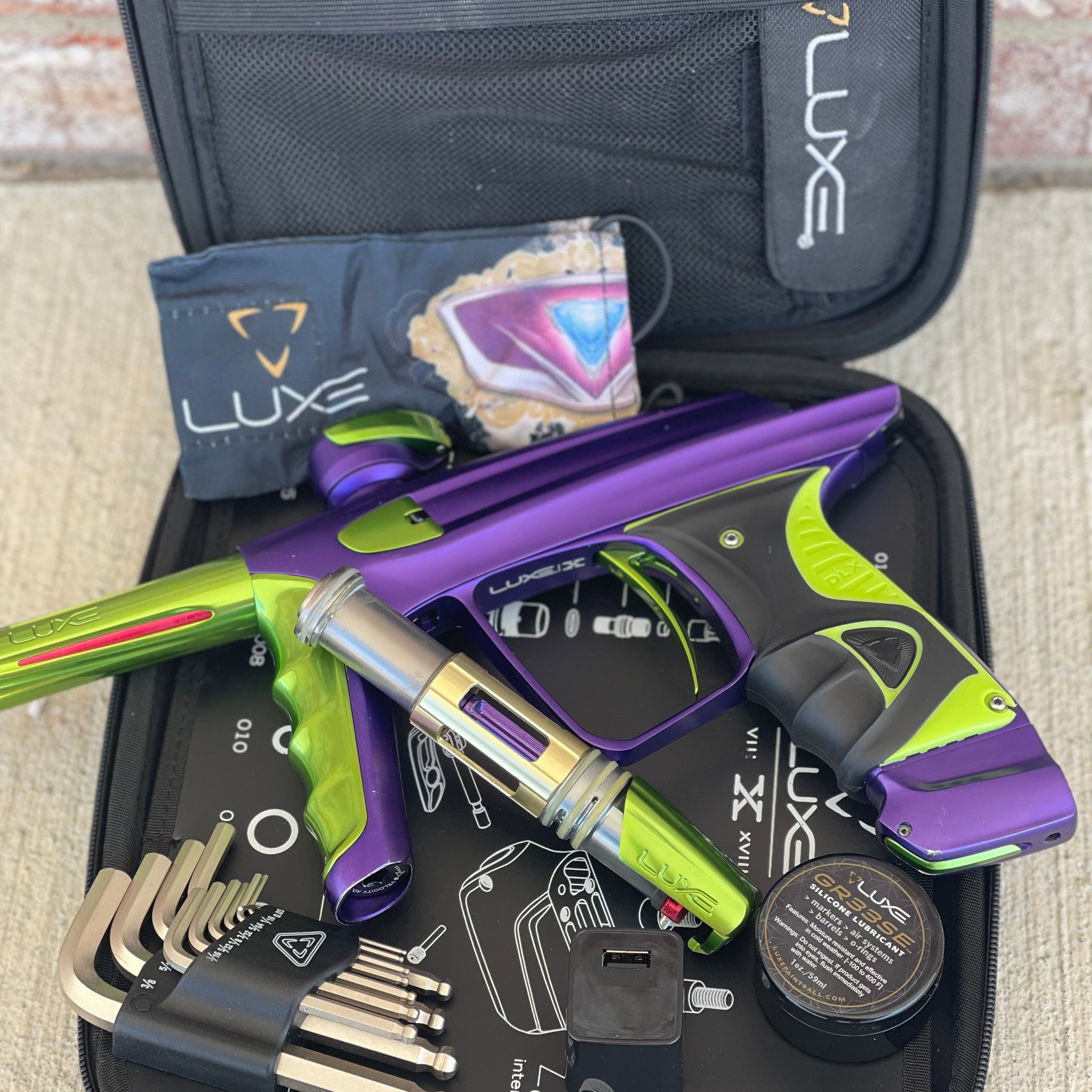 Used DLX Luxe X Paintball Gun - Dust Purple / Polished Green
