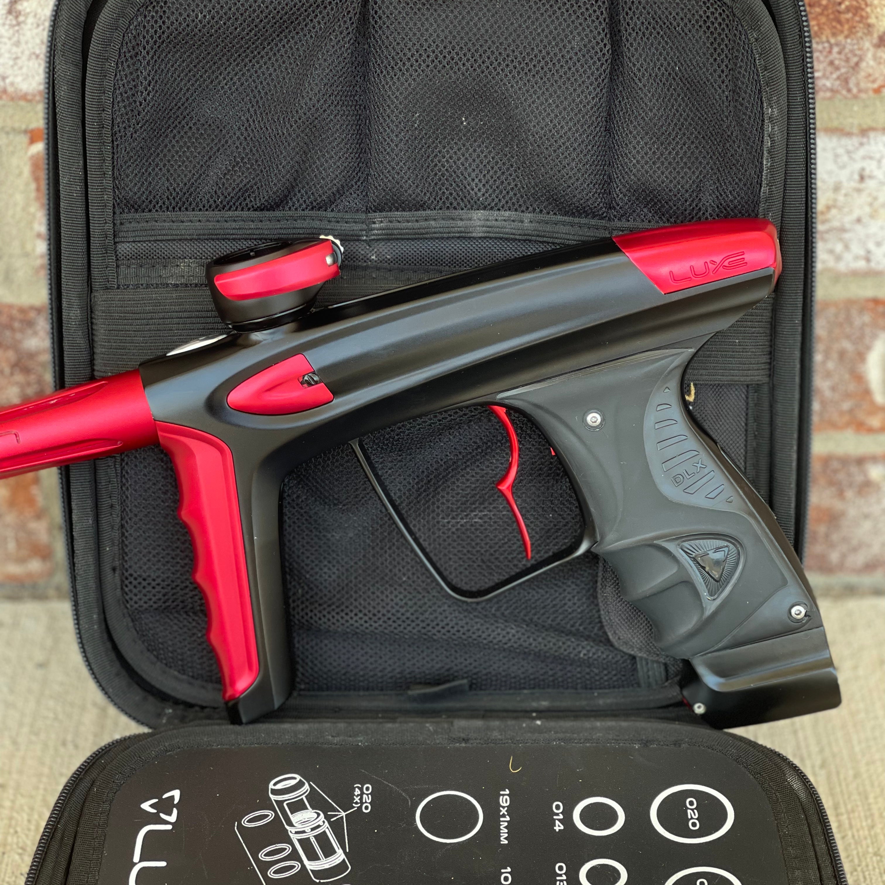 Used DLX Luxe Ice Paintball Gun - Dust Black / Dust Red w/ Infamous Deuce Trigger and 3 Freak Inserts
