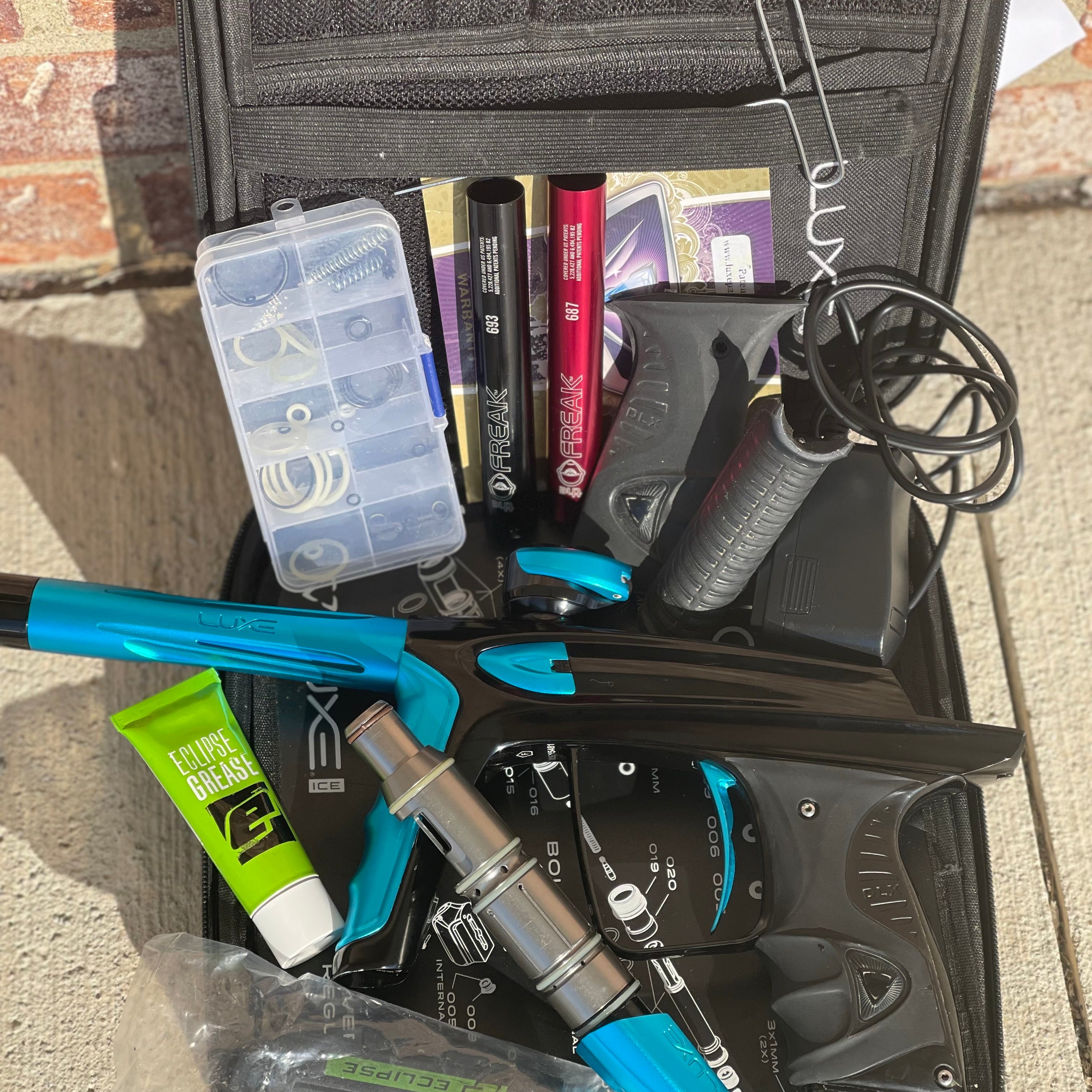 Used DLX Luxe Ice Paintball Gun - Polished Black / Dust Teal