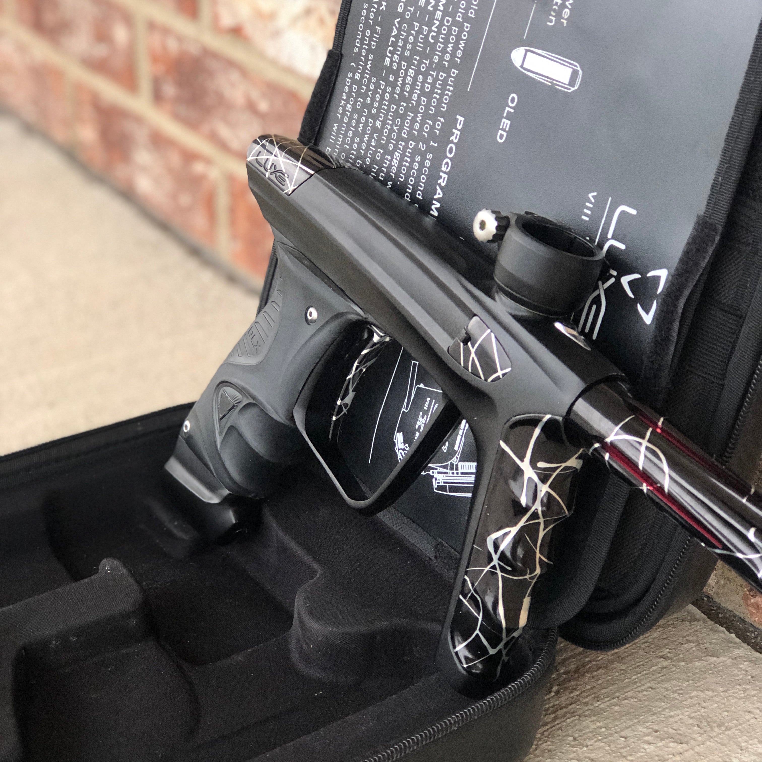 Used DLX Luxe X Paintball Gun - Dust Black w/ Black & Silver Splash Accents