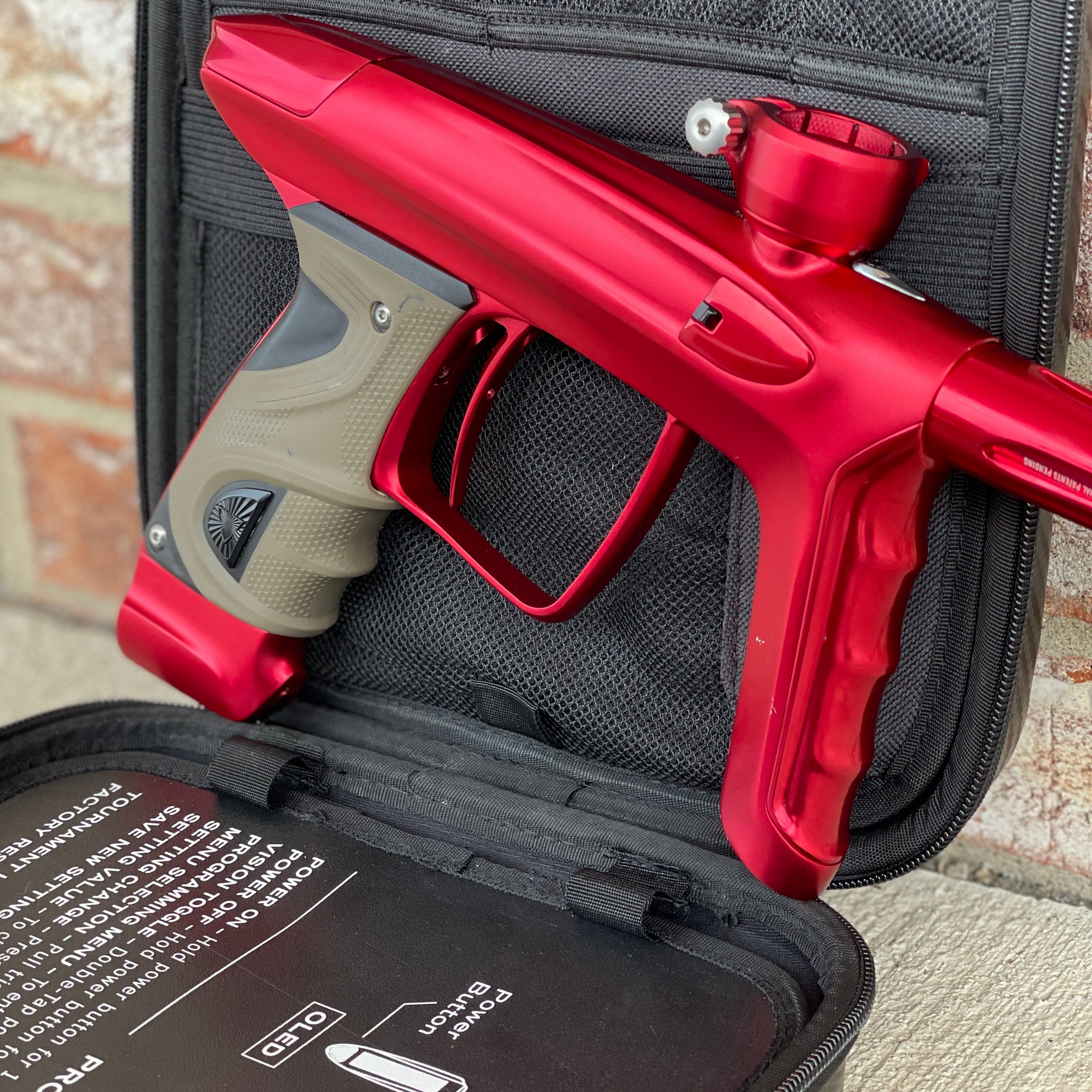 Used DLX Luxe TM40 Paintball Gun - Dust Red / Gloss Red w/ 2 back grips and SSC Soft Tip Bolt