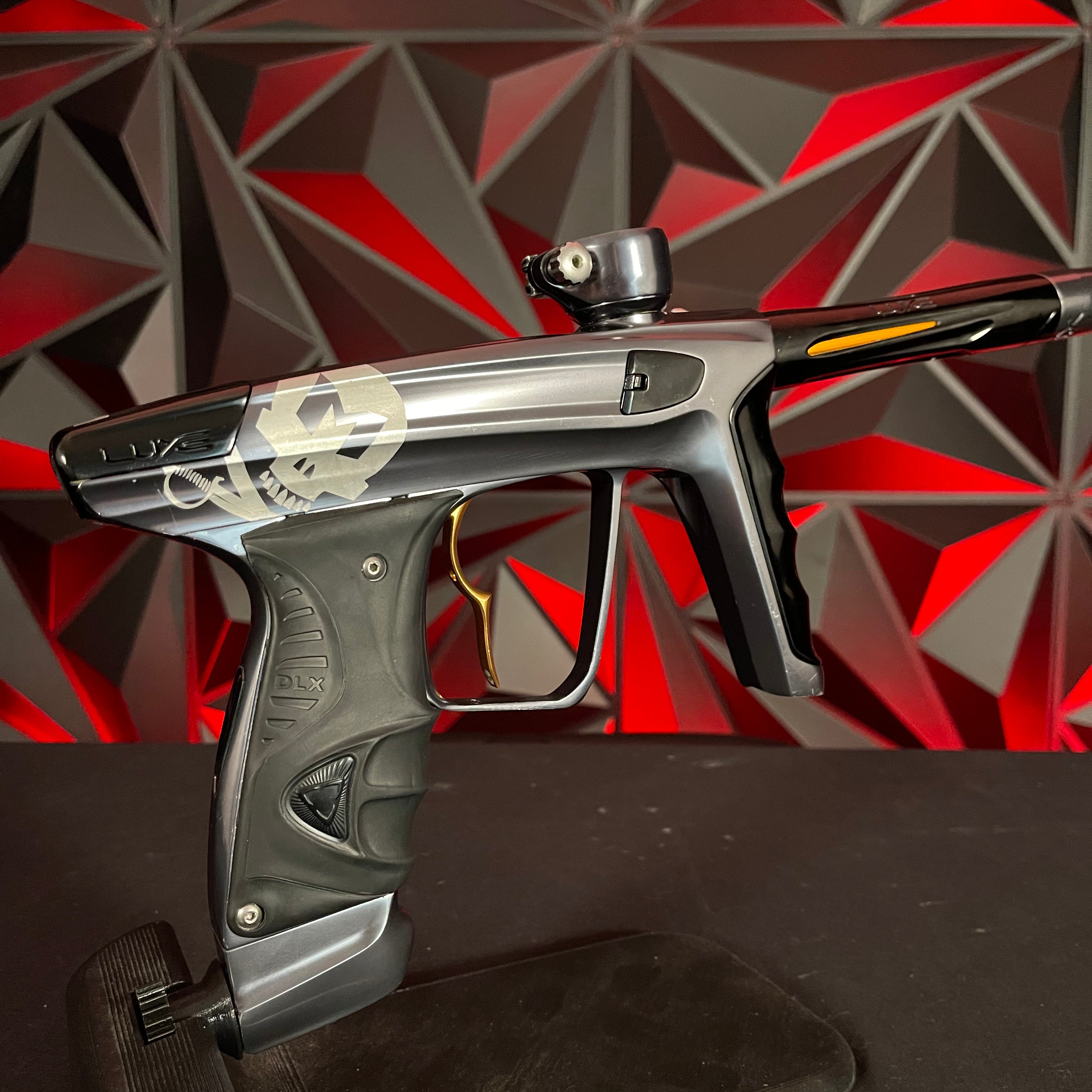 Used DLX Luxe X Paintball Gun - Polished Pewter w/ Infamous Gold Deuce Trigger