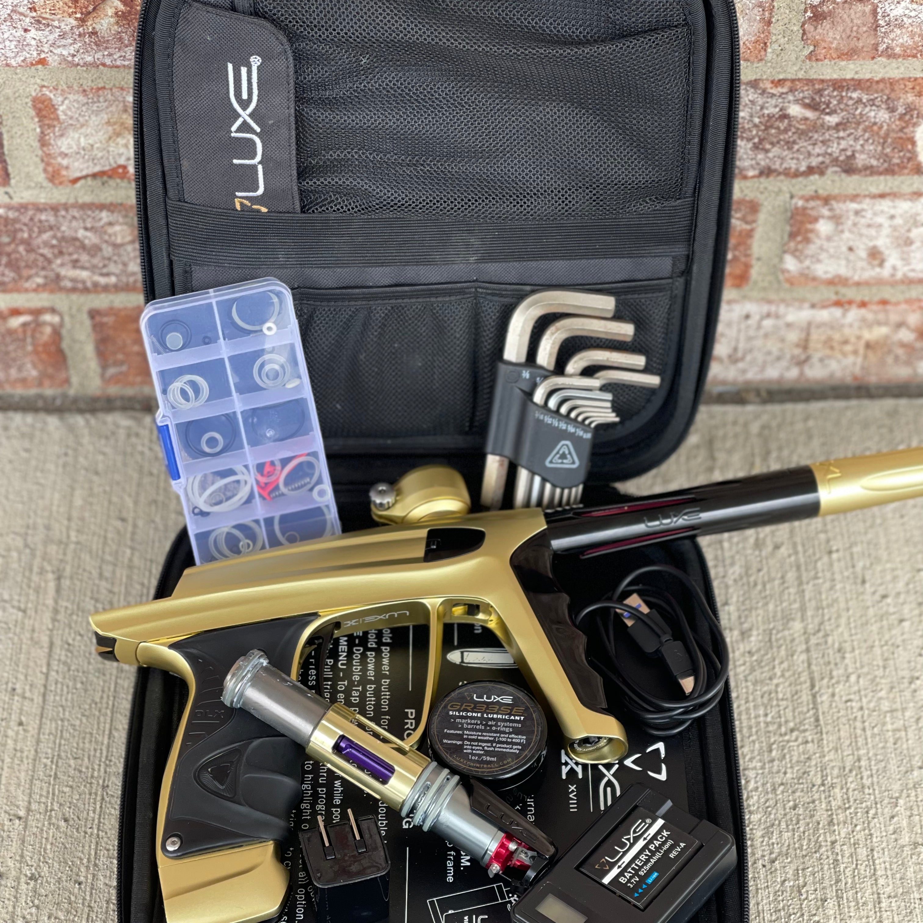 Used DLX Luxe X Paintball Gun - Dust Gold / Polished Black