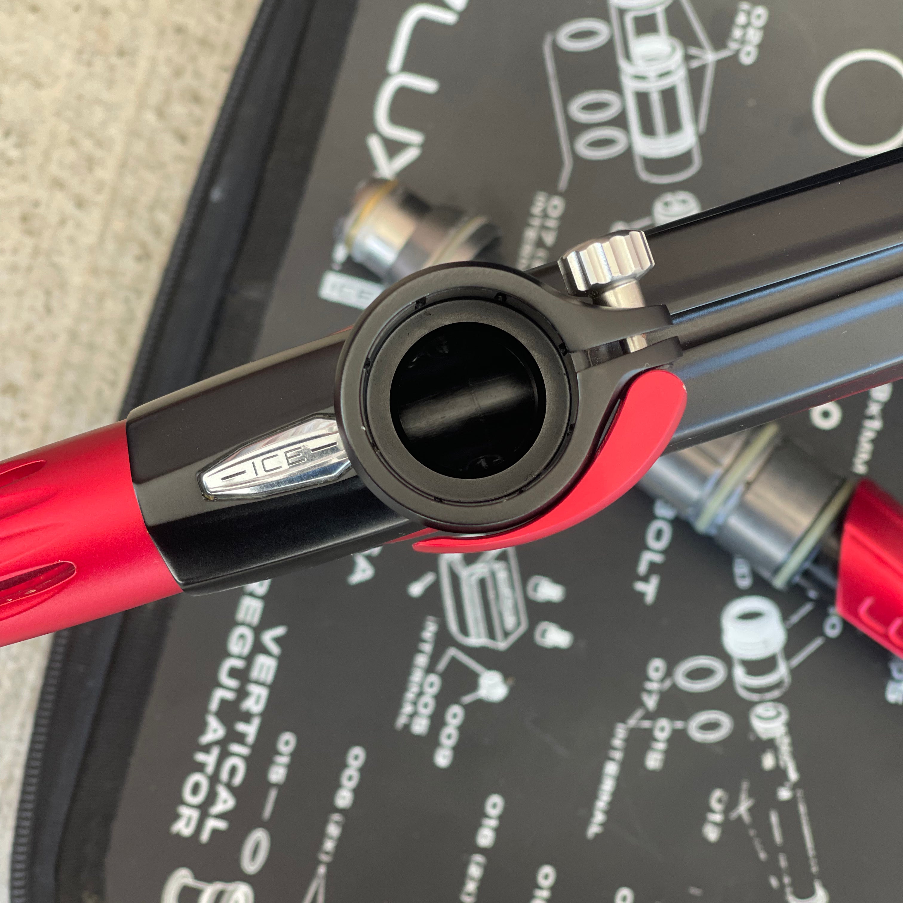 Used DLX Luxe Ice Paintball Gun - Dust Black / Dust Red w/ Infamous Deuce Trigger and 3 Freak Inserts